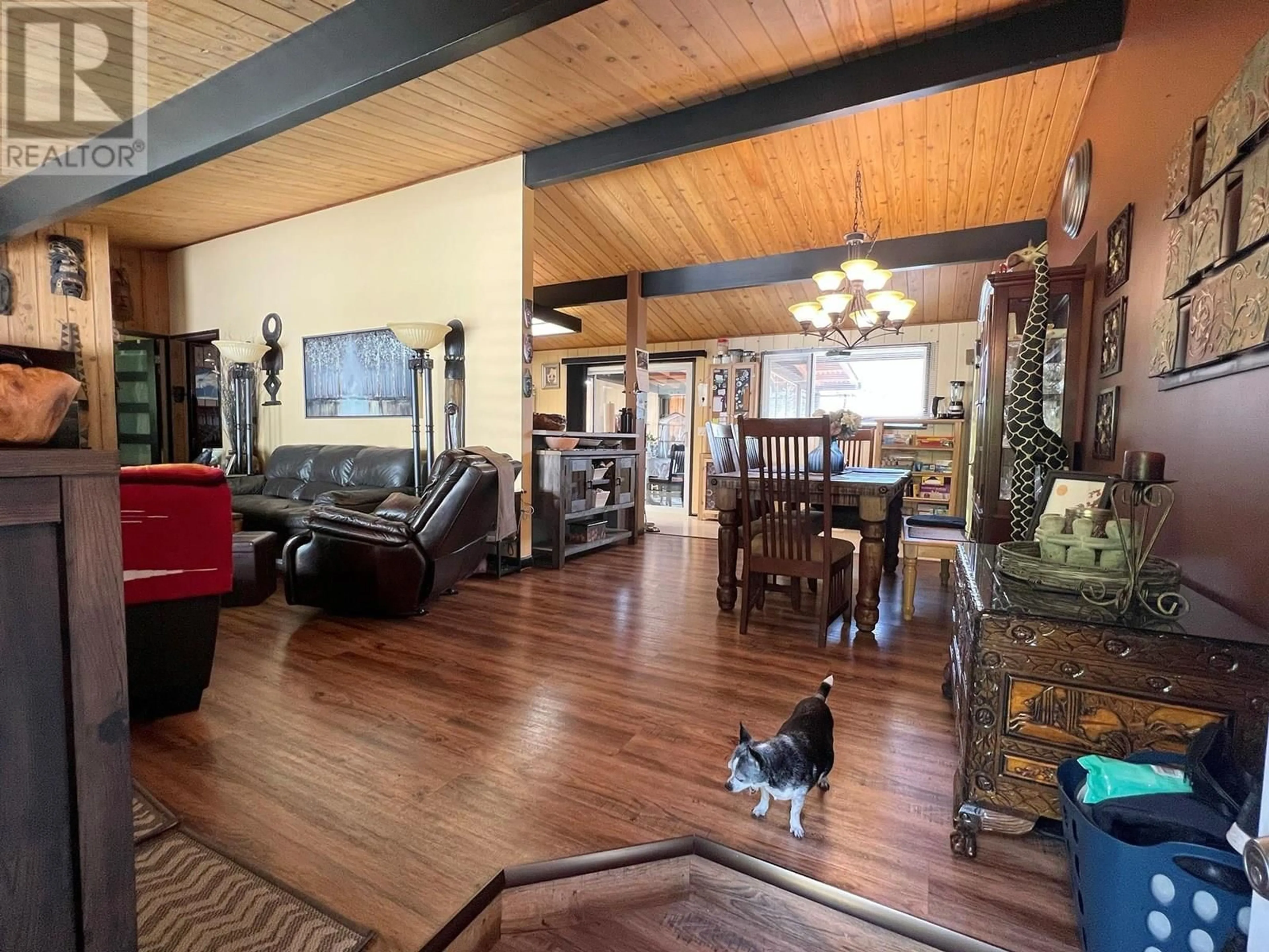 Living room with furniture, wood/laminate floor for 1490 HOLLYWOOD ROAD, Kelowna British Columbia V1X4N9