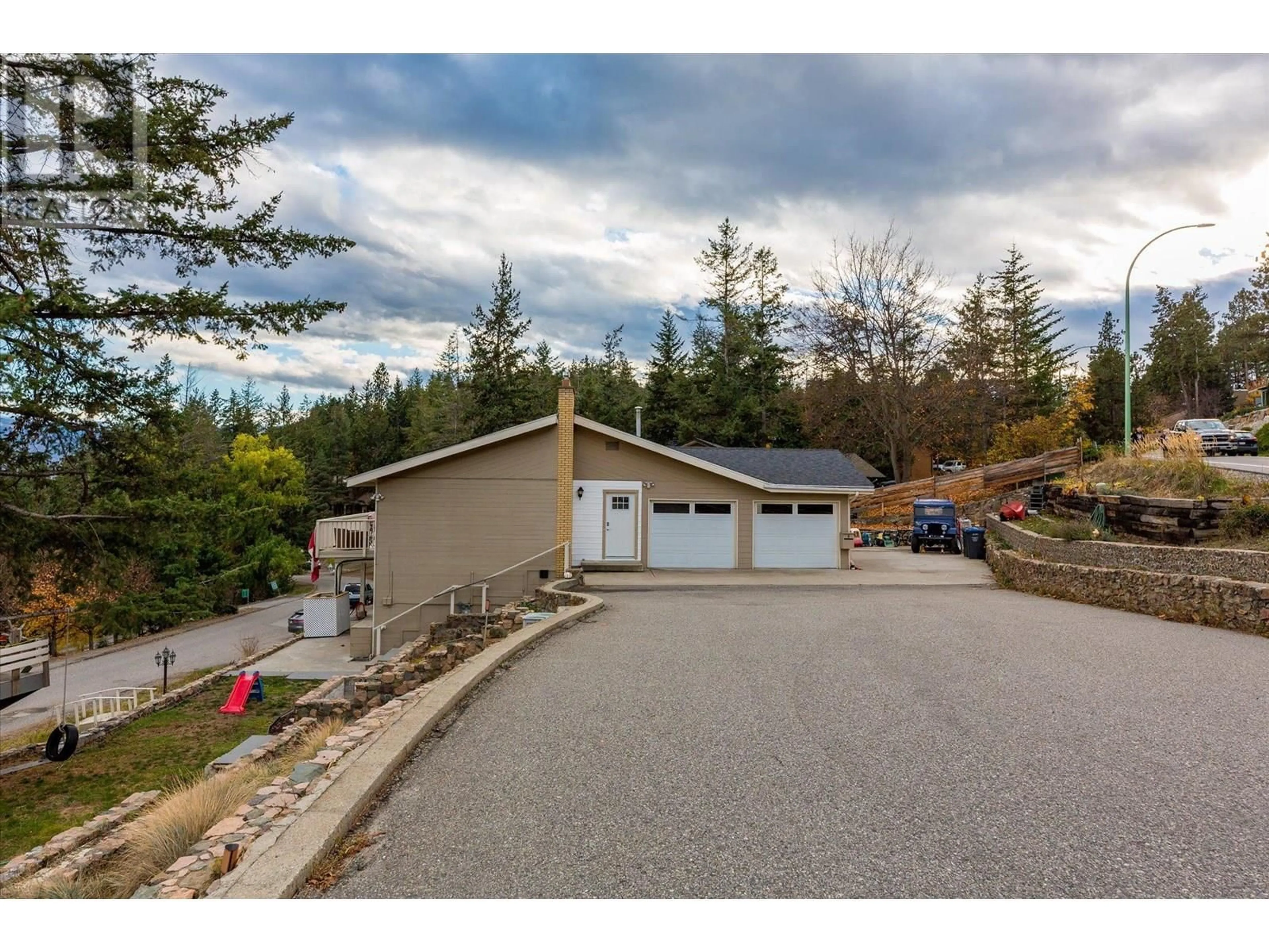 A pic from outside/outdoor area/front of a property/back of a property/a pic from drone, mountain view for 1572 PARKINSON ROAD, West Kelowna British Columbia V1Z2X2