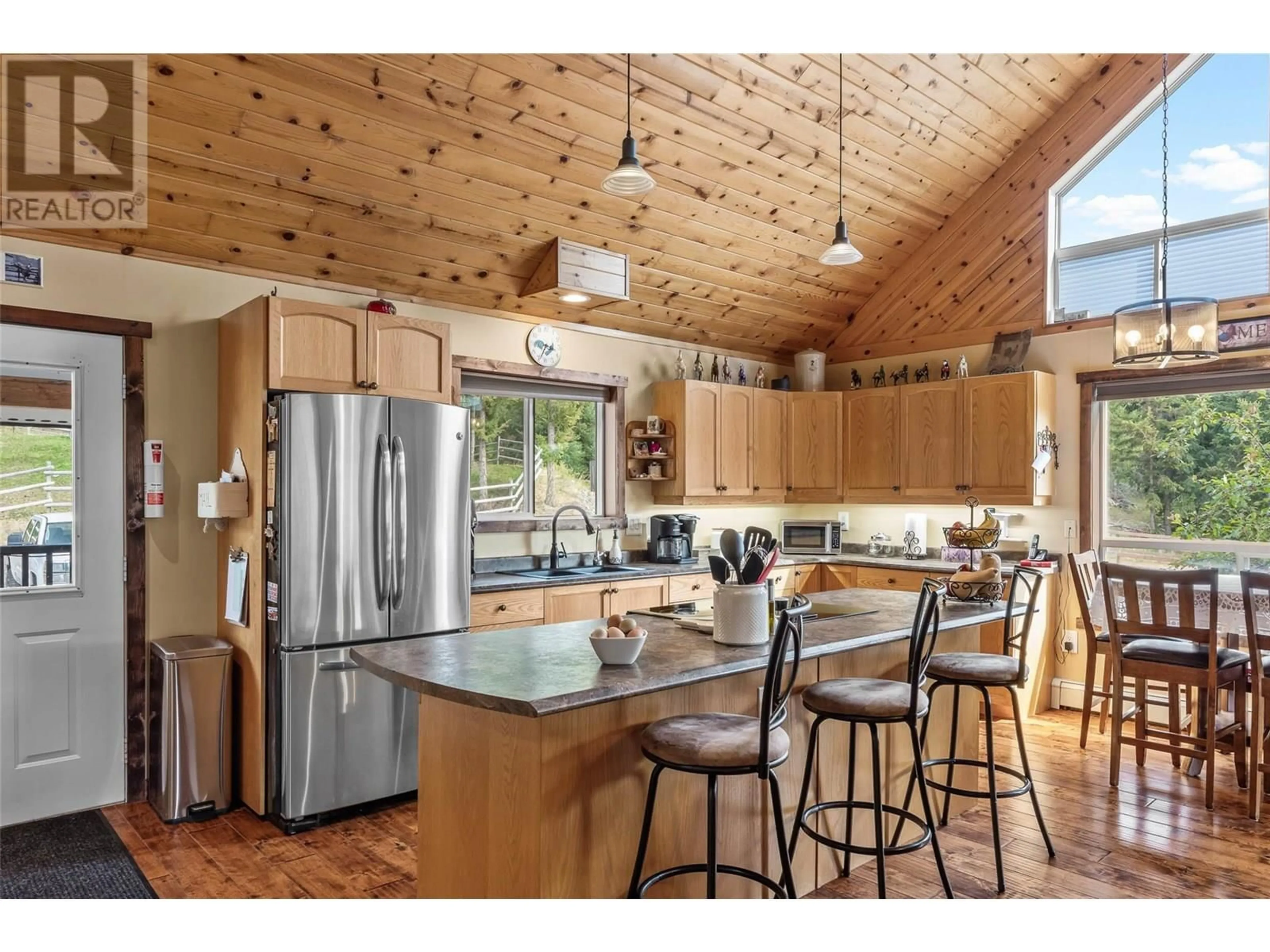 Open concept kitchen, wood/laminate floor for 5841 BEECH ROAD, Merritt British Columbia V1K1M6