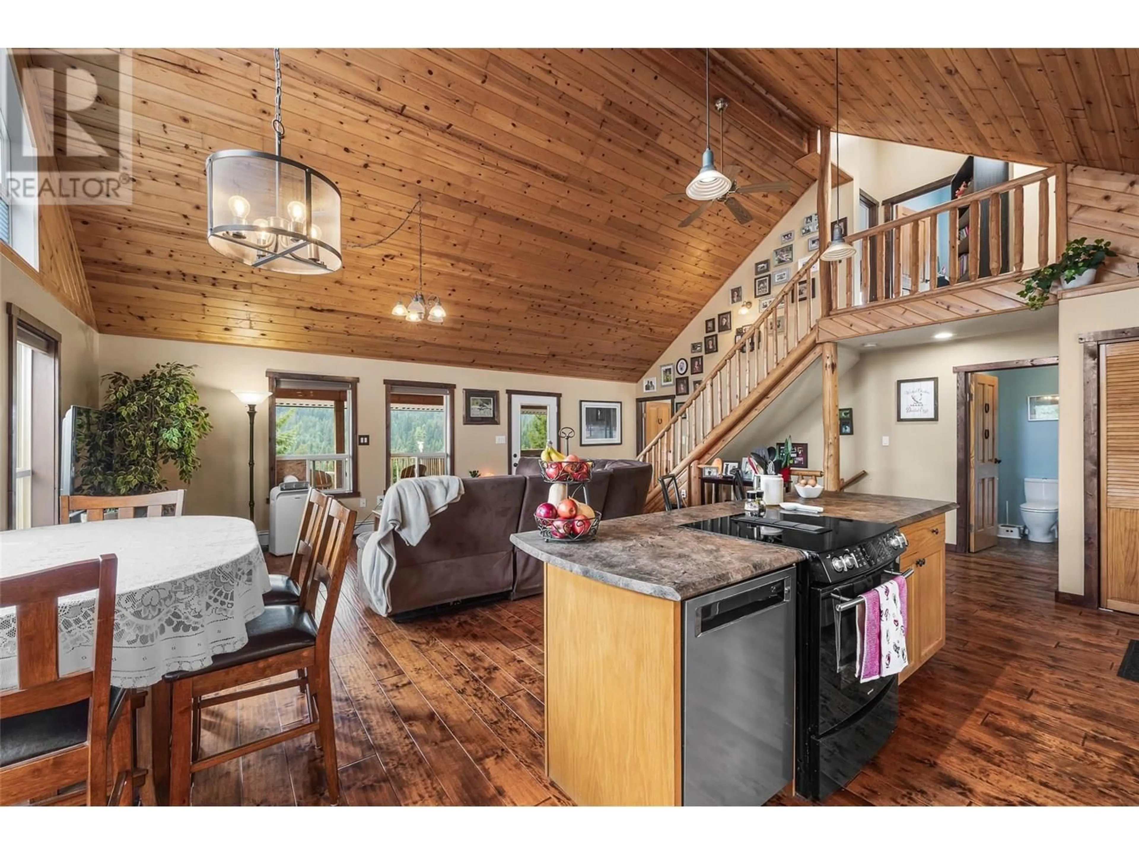 Open concept kitchen, wood/laminate floor for 5841 BEECH ROAD, Merritt British Columbia V1K1M6