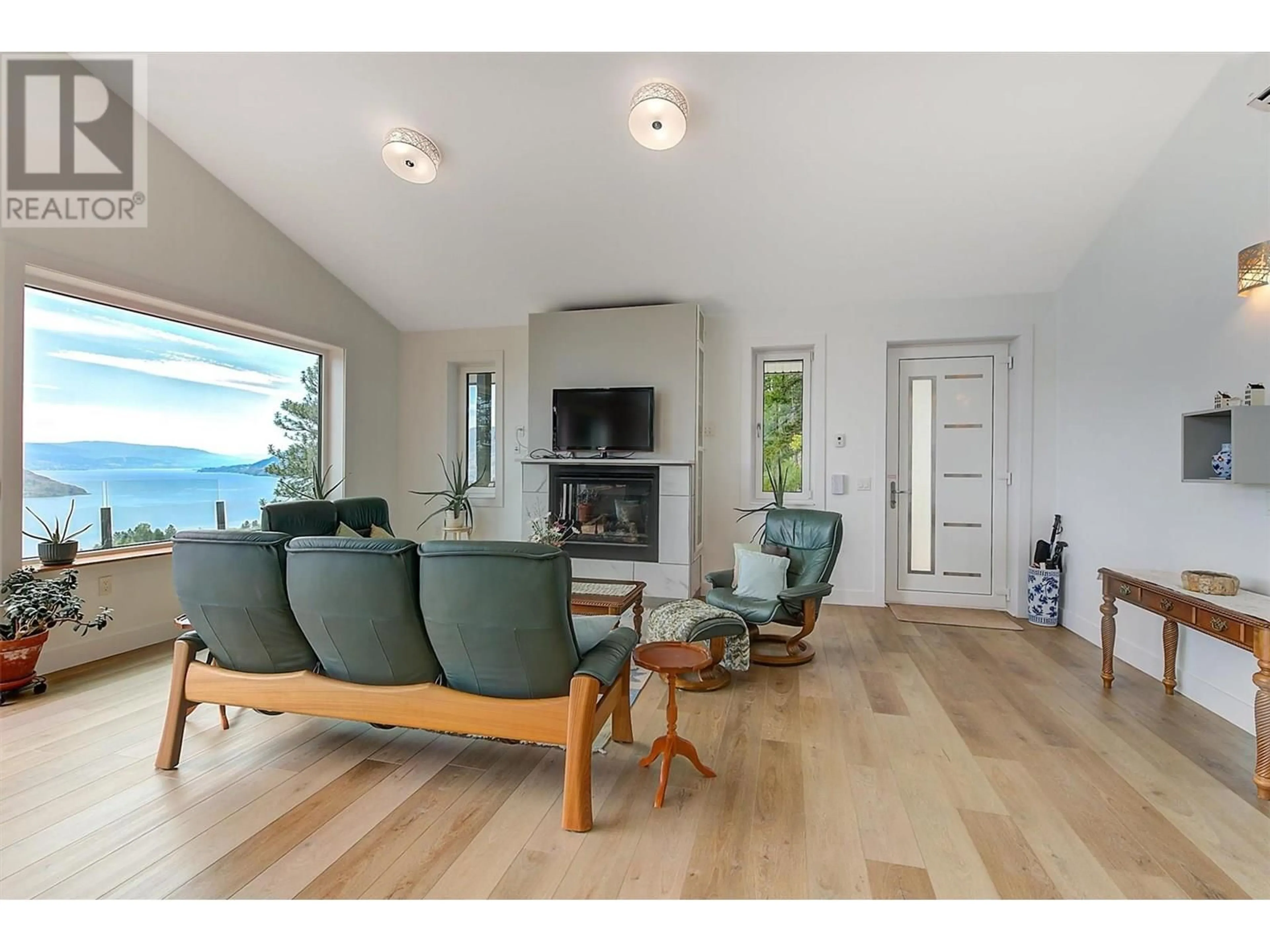 Living room with furniture, wood/laminate floor for 6131 SEYMOURE LANE, Peachland British Columbia V0H1X4