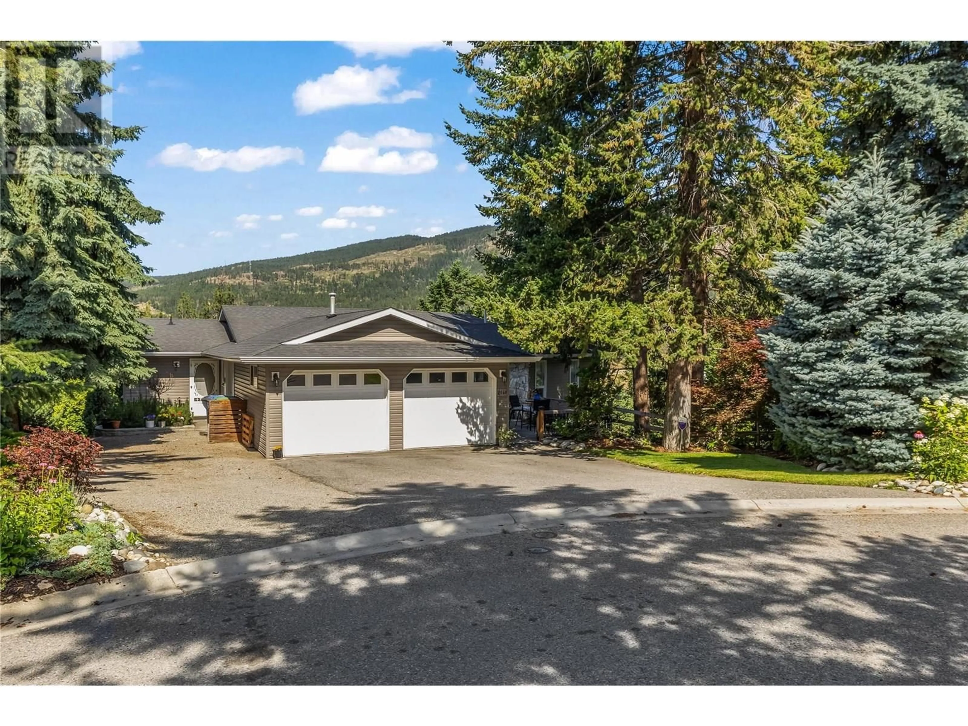 A pic from outside/outdoor area/front of a property/back of a property/a pic from drone, mountain view for 2058 SHANNON WAY, West Kelowna British Columbia V4T1S6
