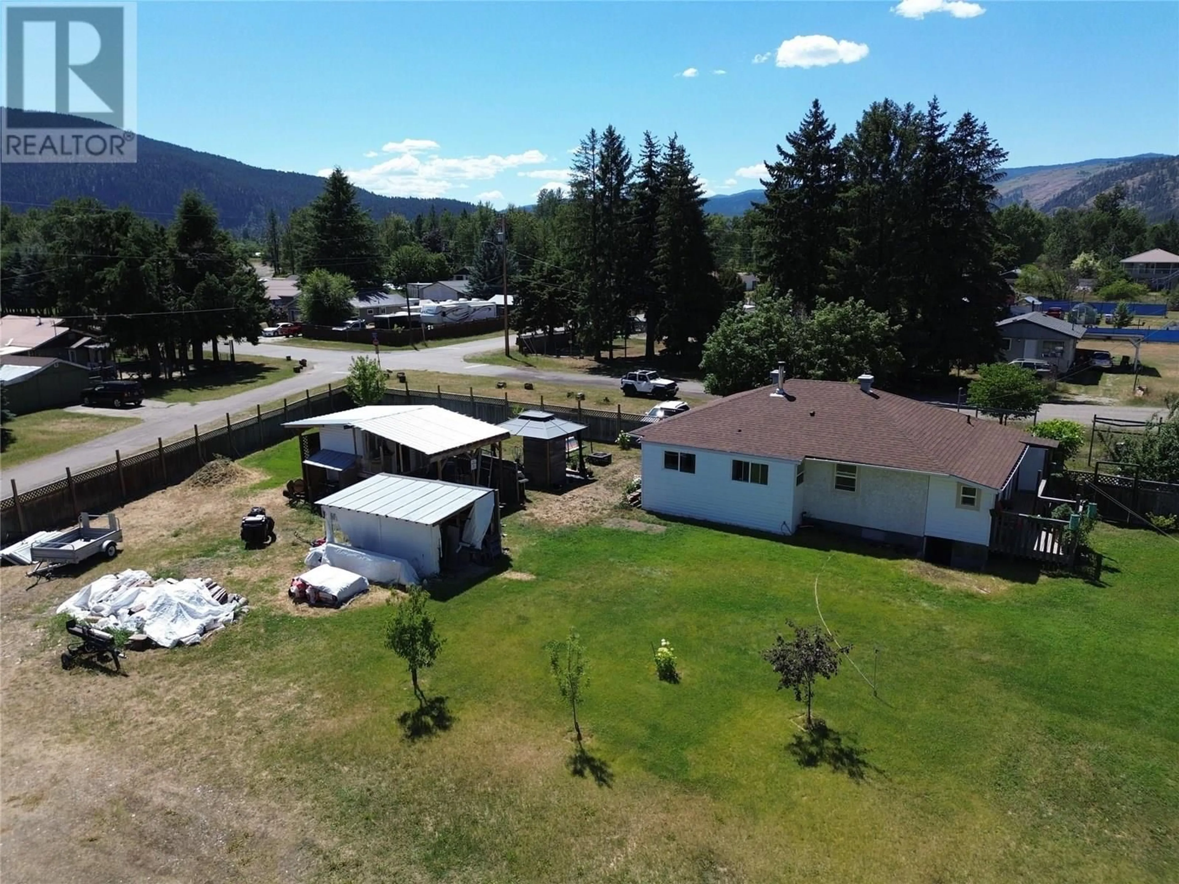 A pic from outside/outdoor area/front of a property/back of a property/a pic from drone, mountain view for 6638 COMO STREET, Grand Forks British Columbia V0H1H4