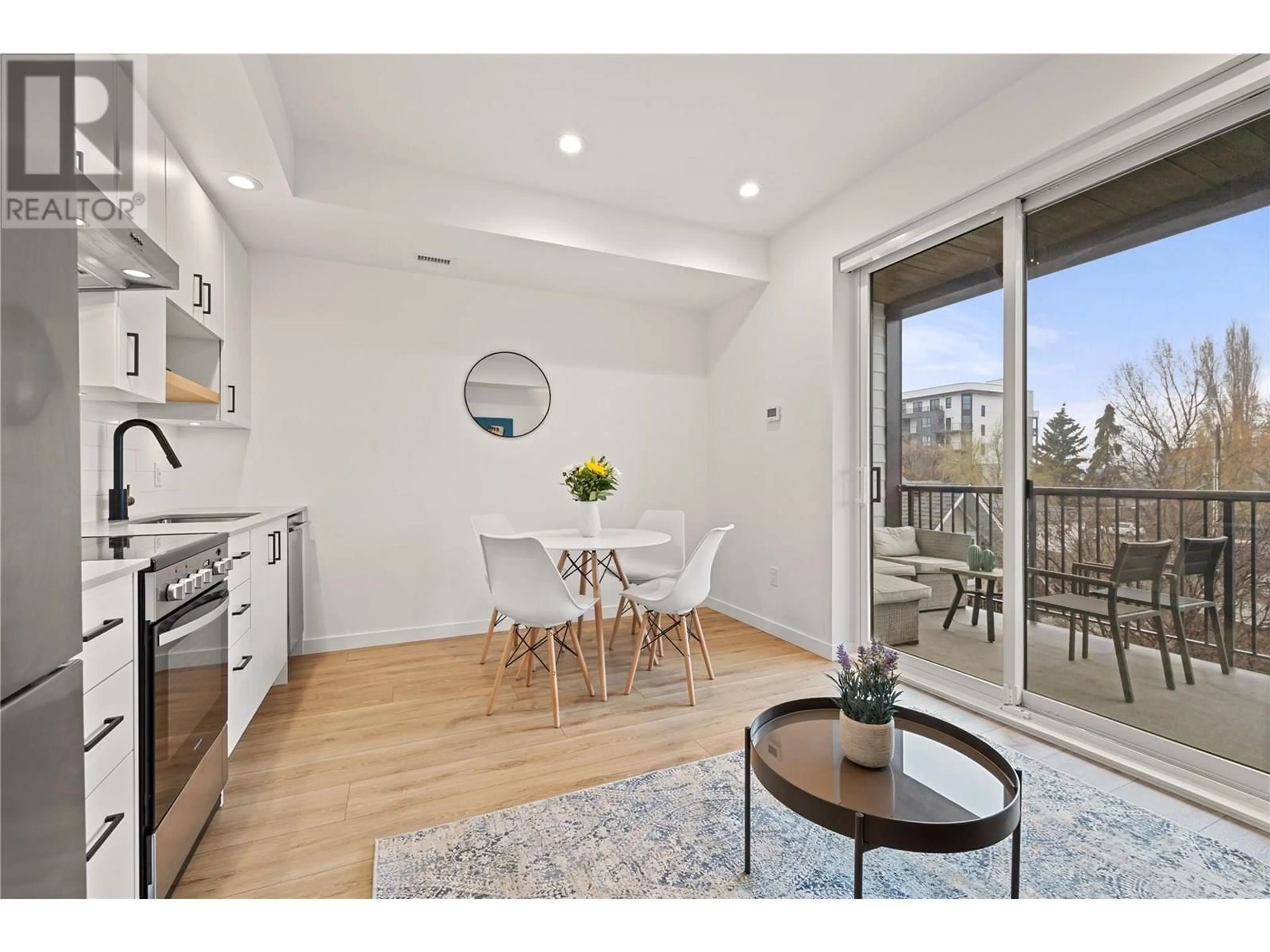 Open concept kitchen, wood/laminate floor for 208 - 660 CAWSTON AVENUE, Kelowna British Columbia V1Y2L1
