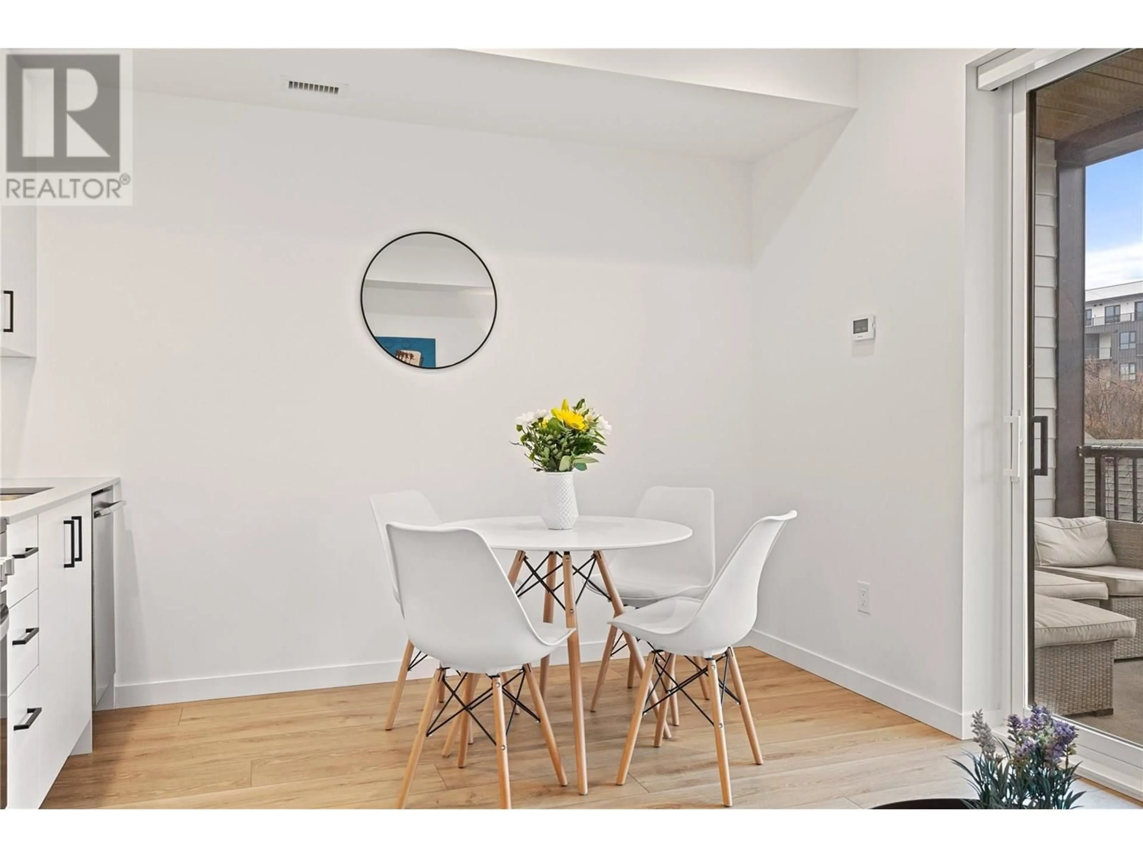 Dining room, wood/laminate floor for 208 - 660 CAWSTON AVENUE, Kelowna British Columbia V1Y2L1