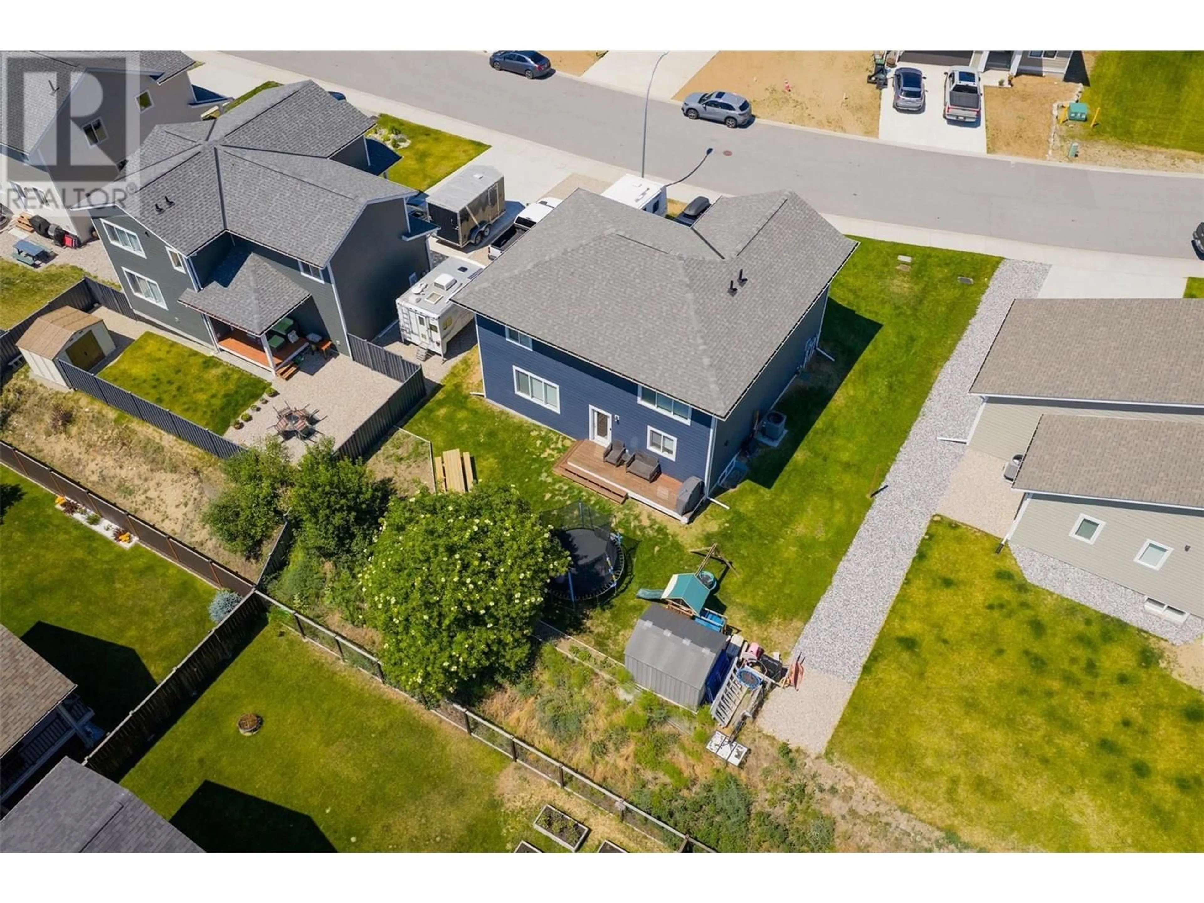 A pic from outside/outdoor area/front of a property/back of a property/a pic from drone, street for 1508 ASPEN LANE, Castlegar British Columbia V1N4X8