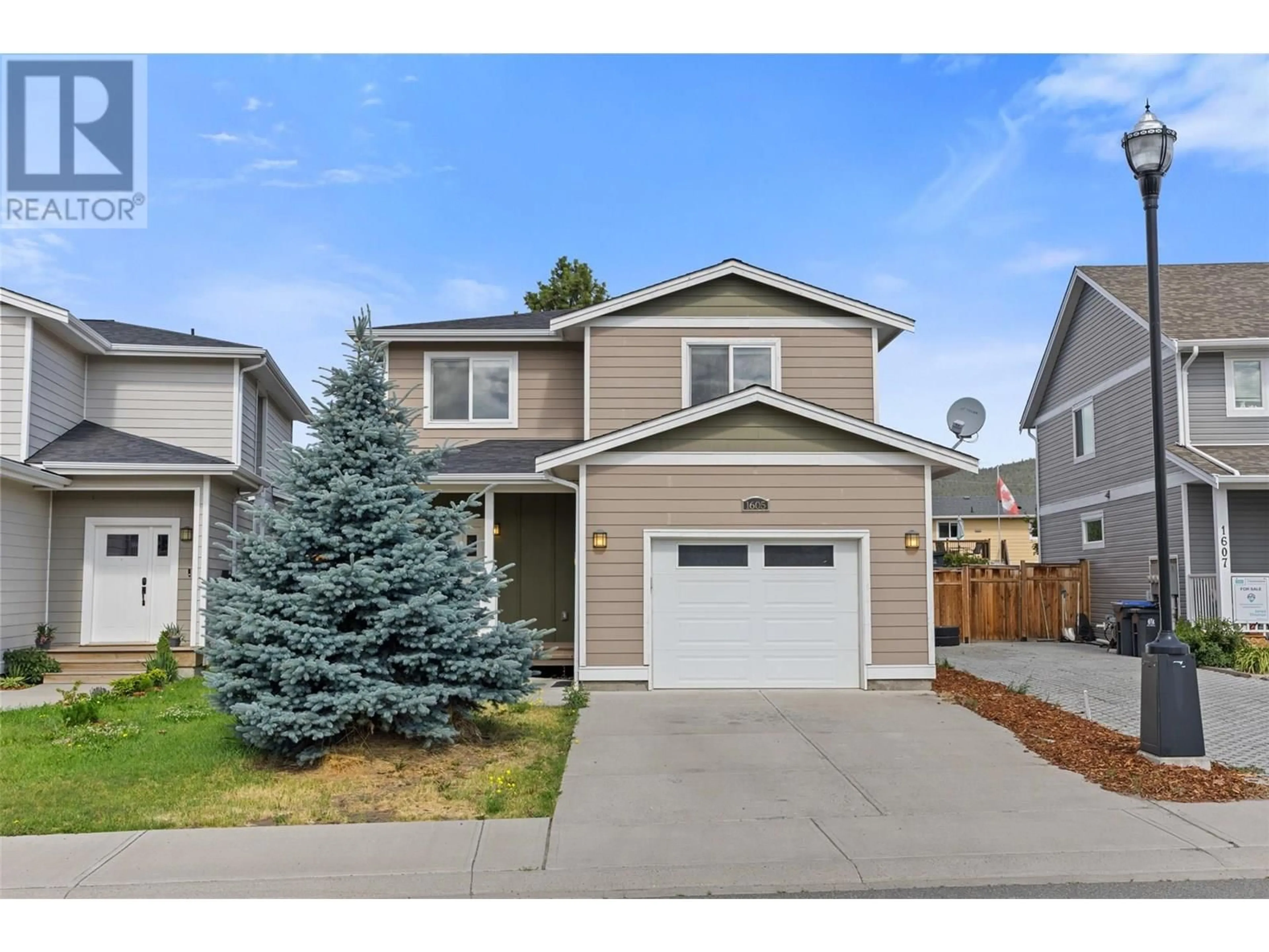 Home with vinyl exterior material, street for 1605 PHILLIPS STREET, Merritt British Columbia V1K0B8