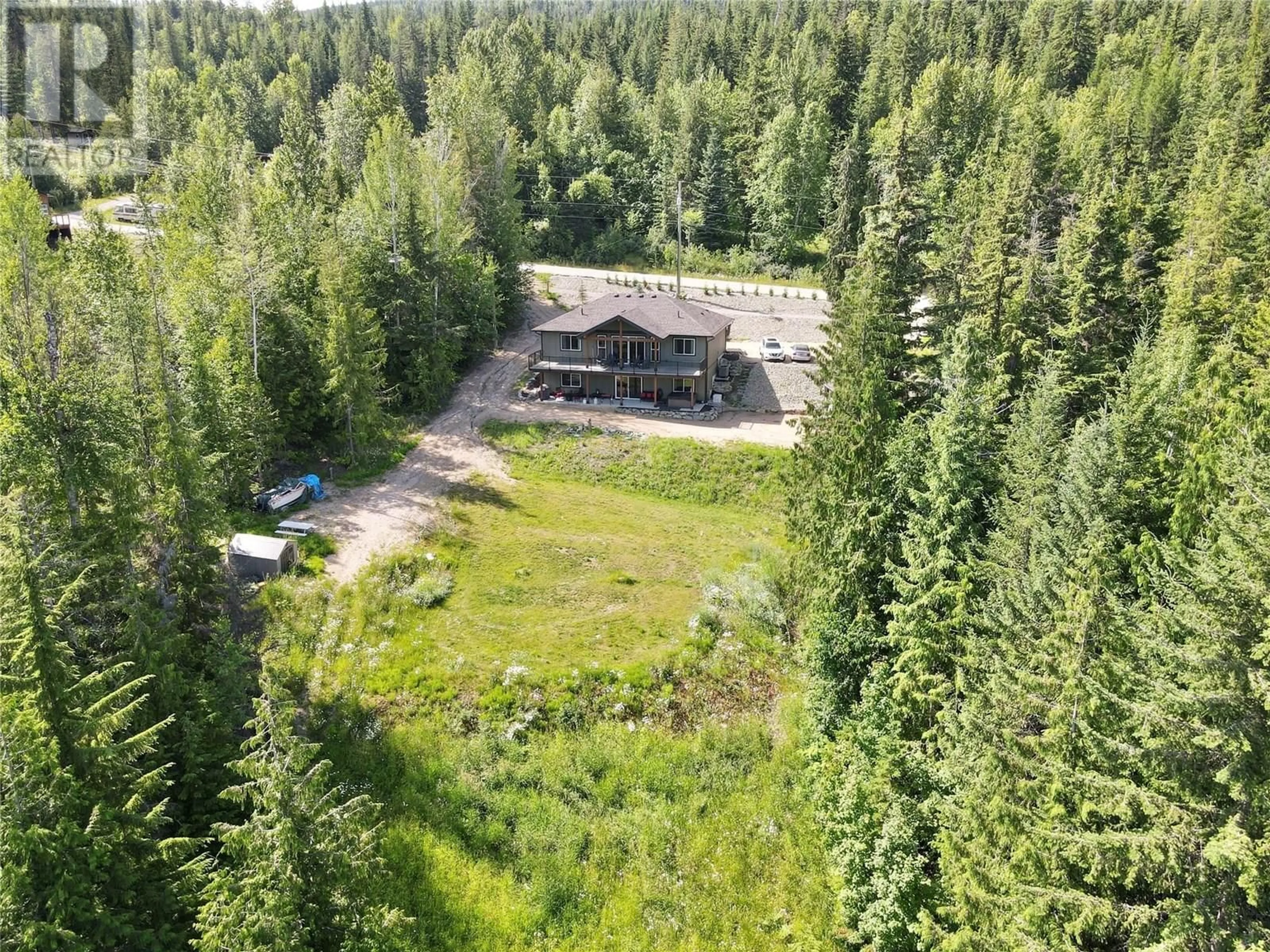 A pic from outside/outdoor area/front of a property/back of a property/a pic from drone, forest/trees view for 4959 IVY ROAD, Eagle Bay British Columbia V0E1T0