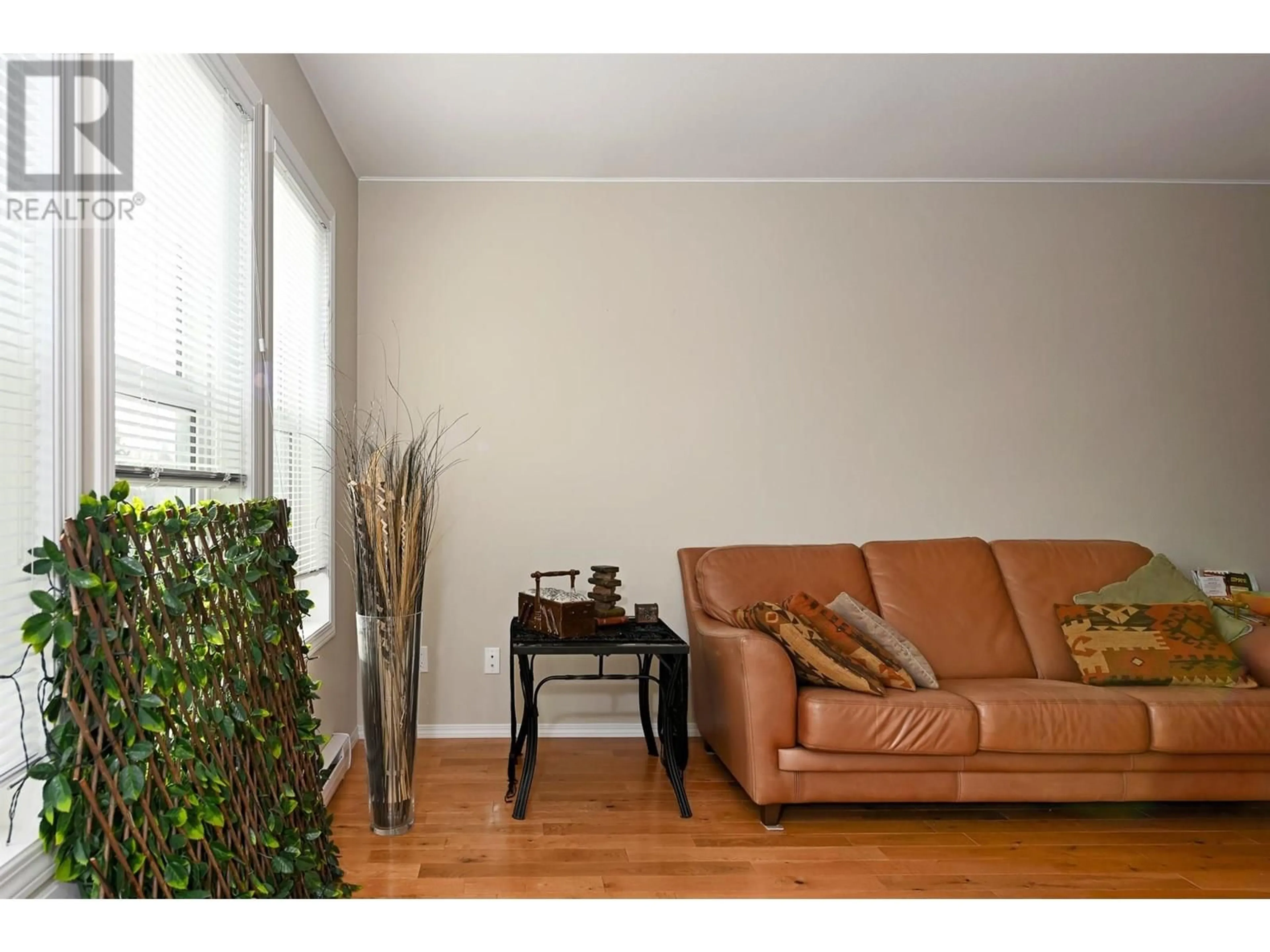Living room with furniture, wood/laminate floor for 8902 DOHERTY STREET, Canal Flats British Columbia V0B1B0
