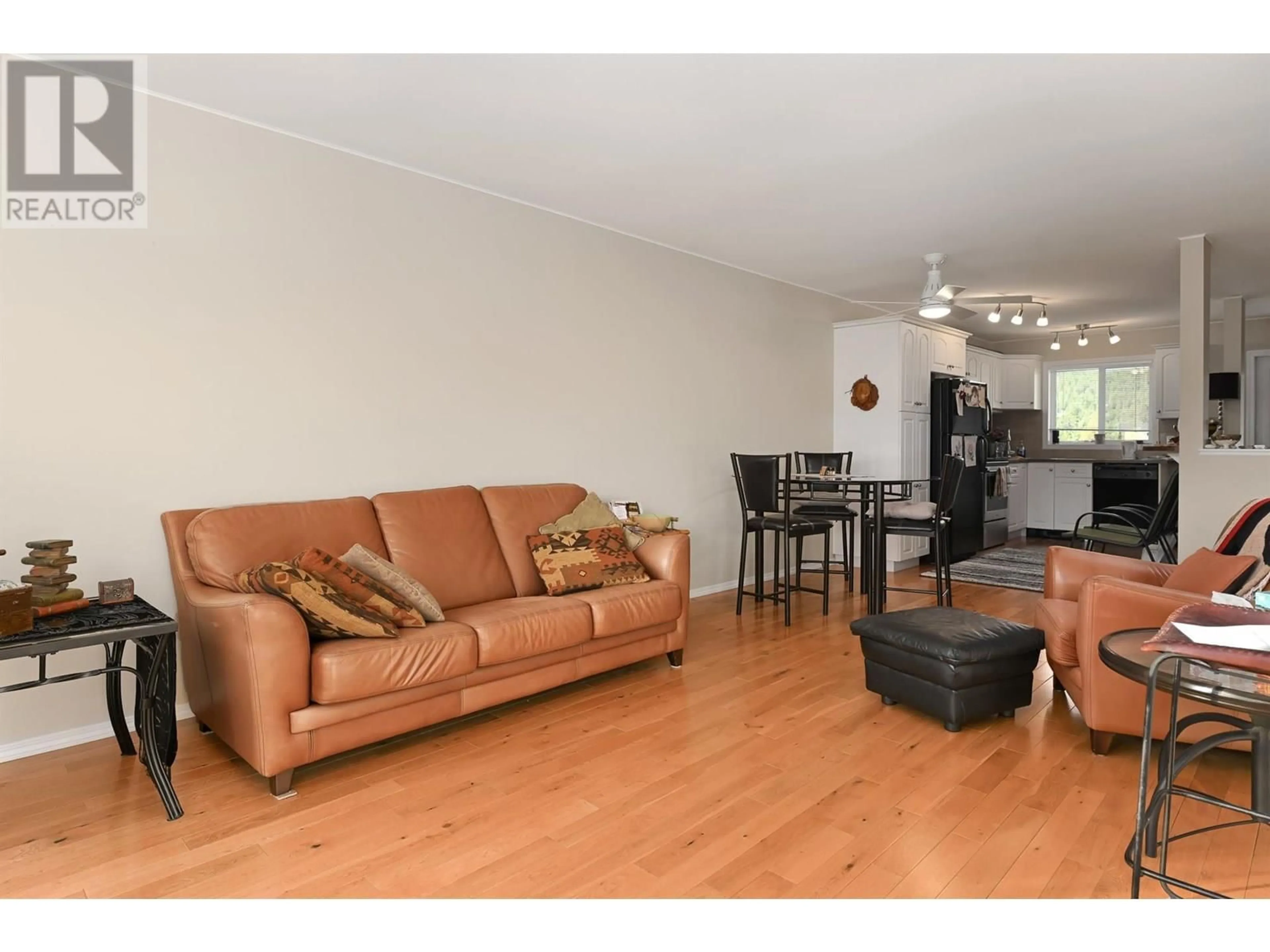 Living room with furniture, wood/laminate floor for 8902 DOHERTY STREET, Canal Flats British Columbia V0B1B0
