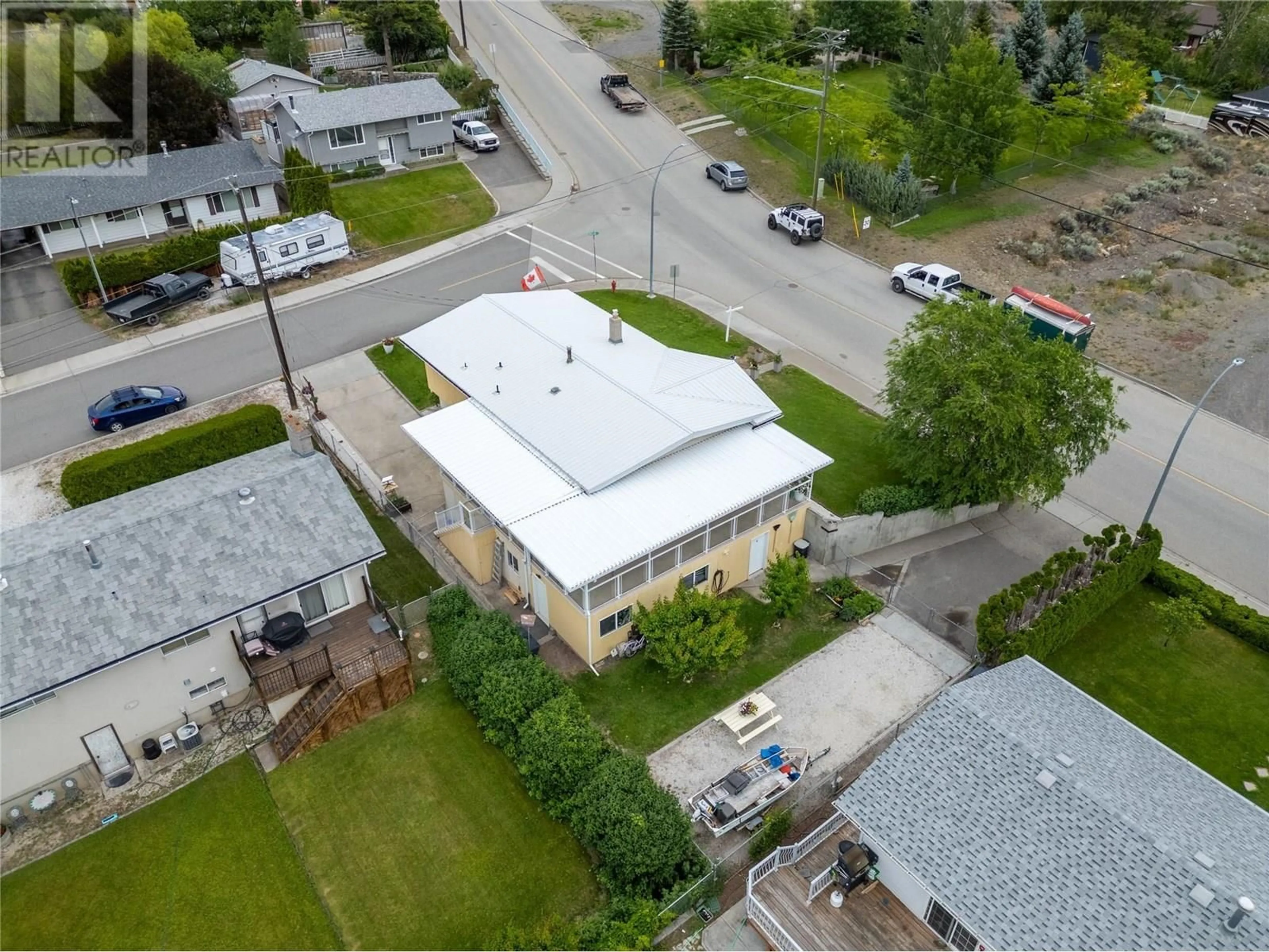 A pic from outside/outdoor area/front of a property/back of a property/a pic from drone, building for 1118 MACLEAN CRESCENT, Cache Creek British Columbia V0K1H0