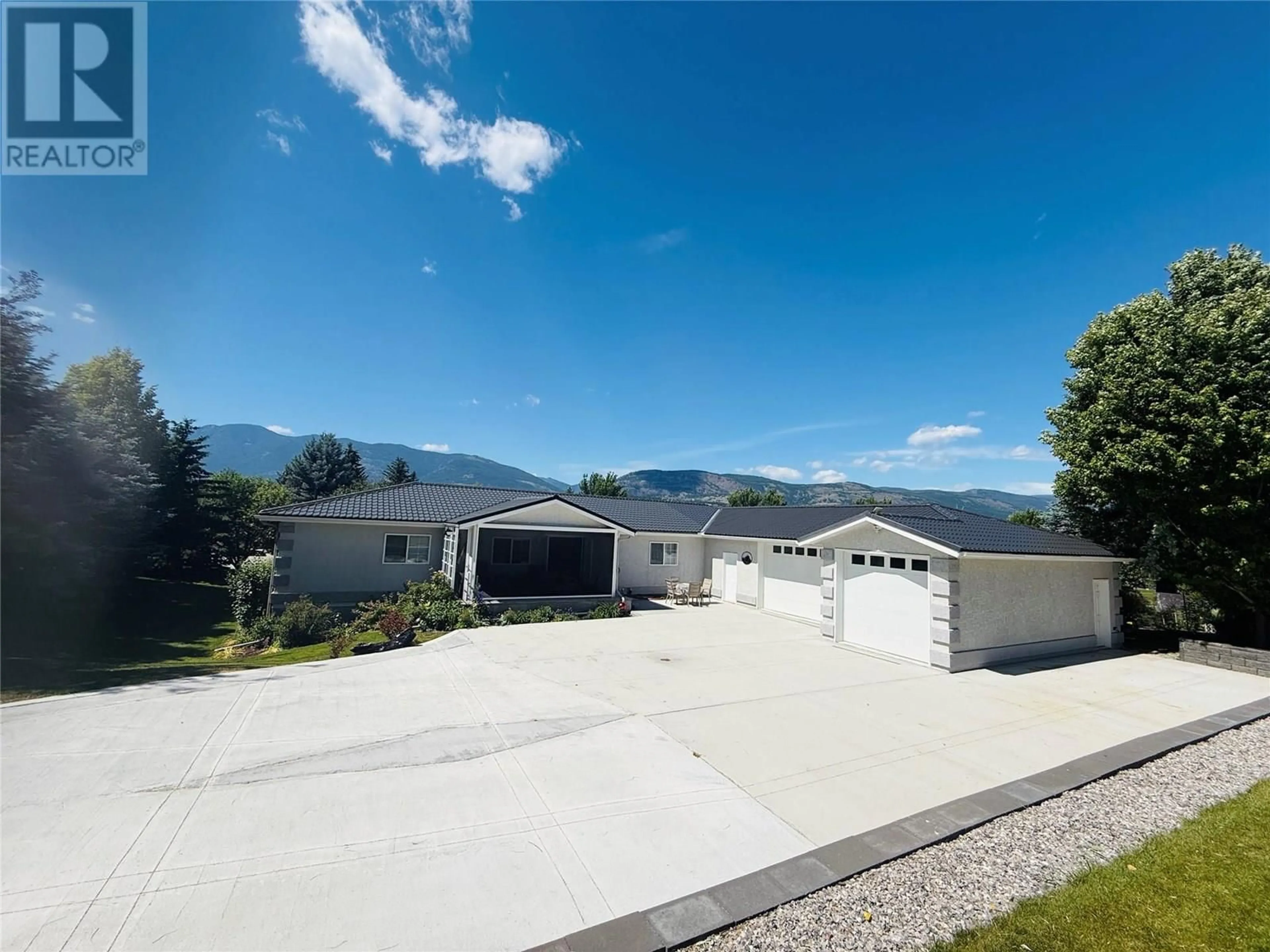 A pic from outside/outdoor area/front of a property/back of a property/a pic from drone, mountain view for 4891 GLEN EAGLE DRIVE, Fairmont Hot Springs British Columbia V0B1B0