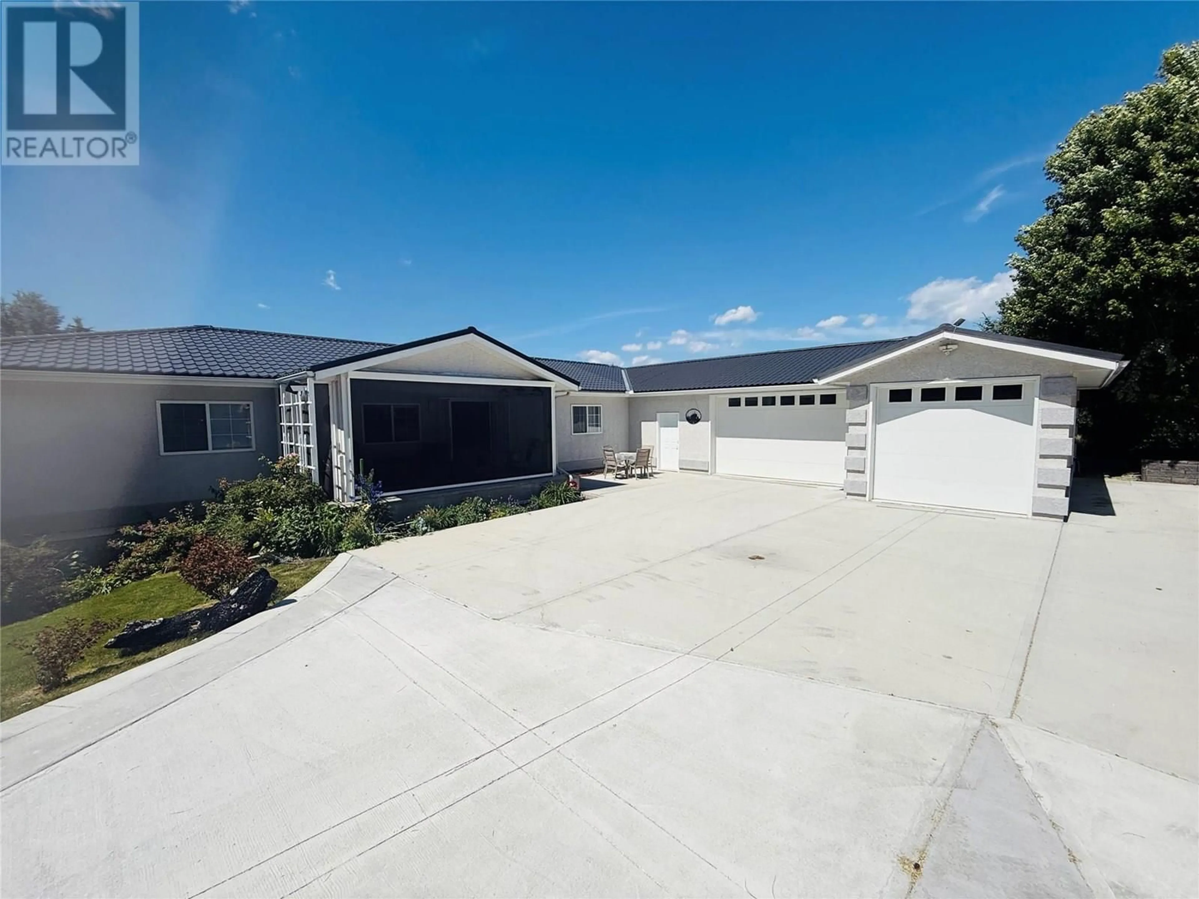 A pic from outside/outdoor area/front of a property/back of a property/a pic from drone, street for 4891 GLEN EAGLE DRIVE, Fairmont Hot Springs British Columbia V0B1B0