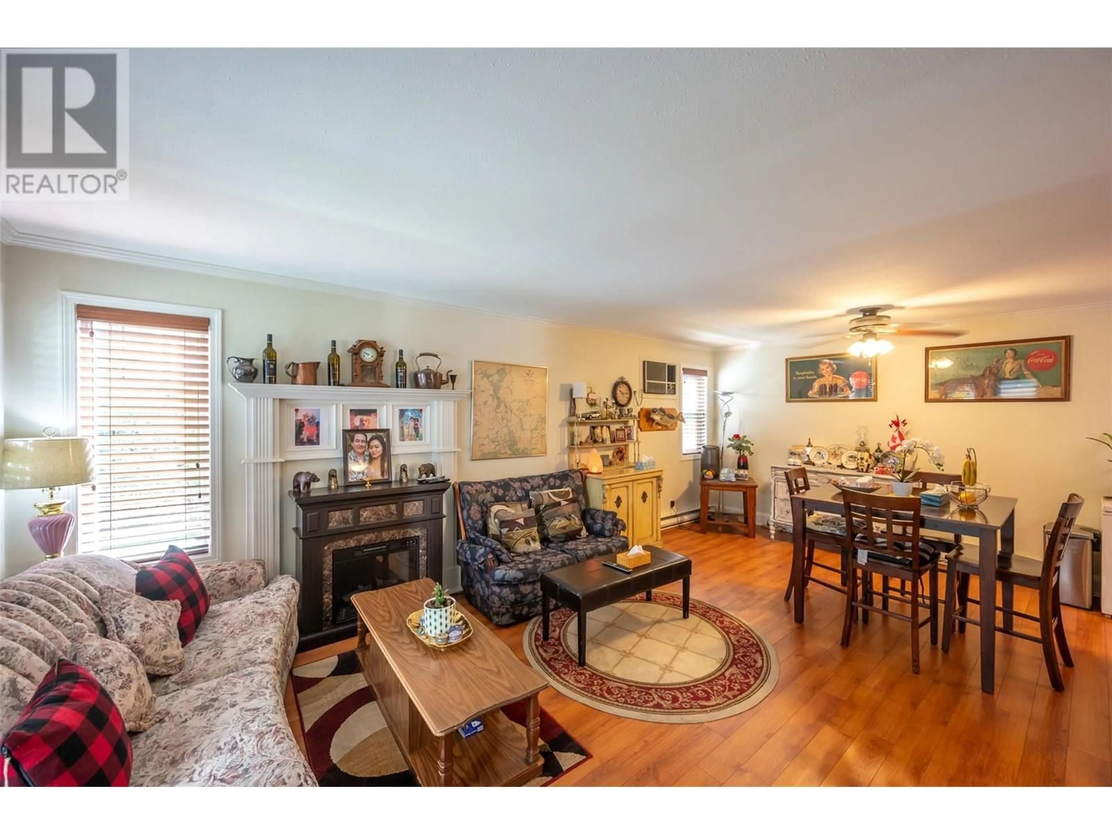 Living room with furniture, wood/laminate floor for 104 - 1780 ATKINSON STREET, Penticton British Columbia V2A7M6