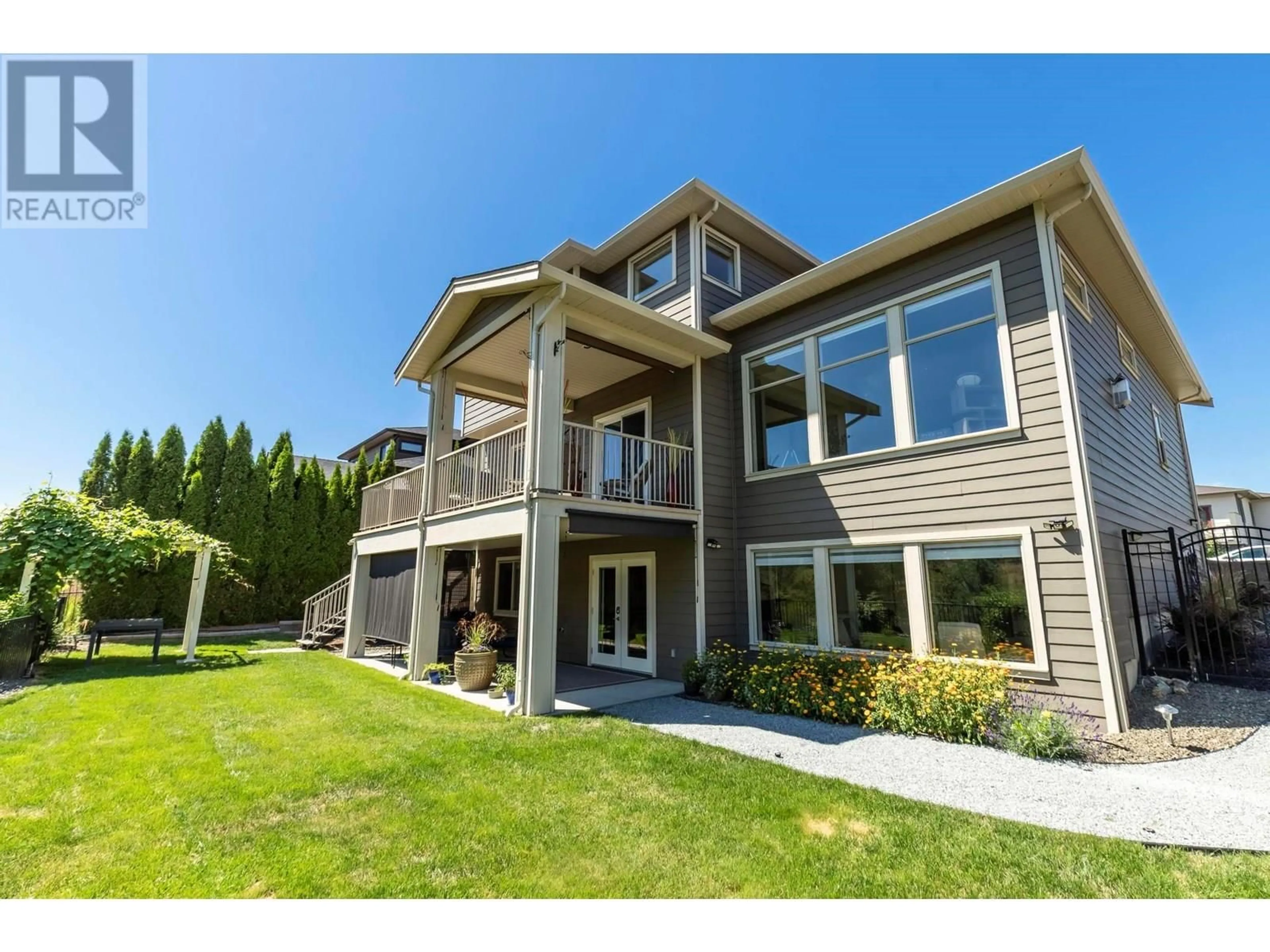 Home with vinyl exterior material, mountain view for 473 SWAN DRIVE, Kelowna British Columbia V1W5J5