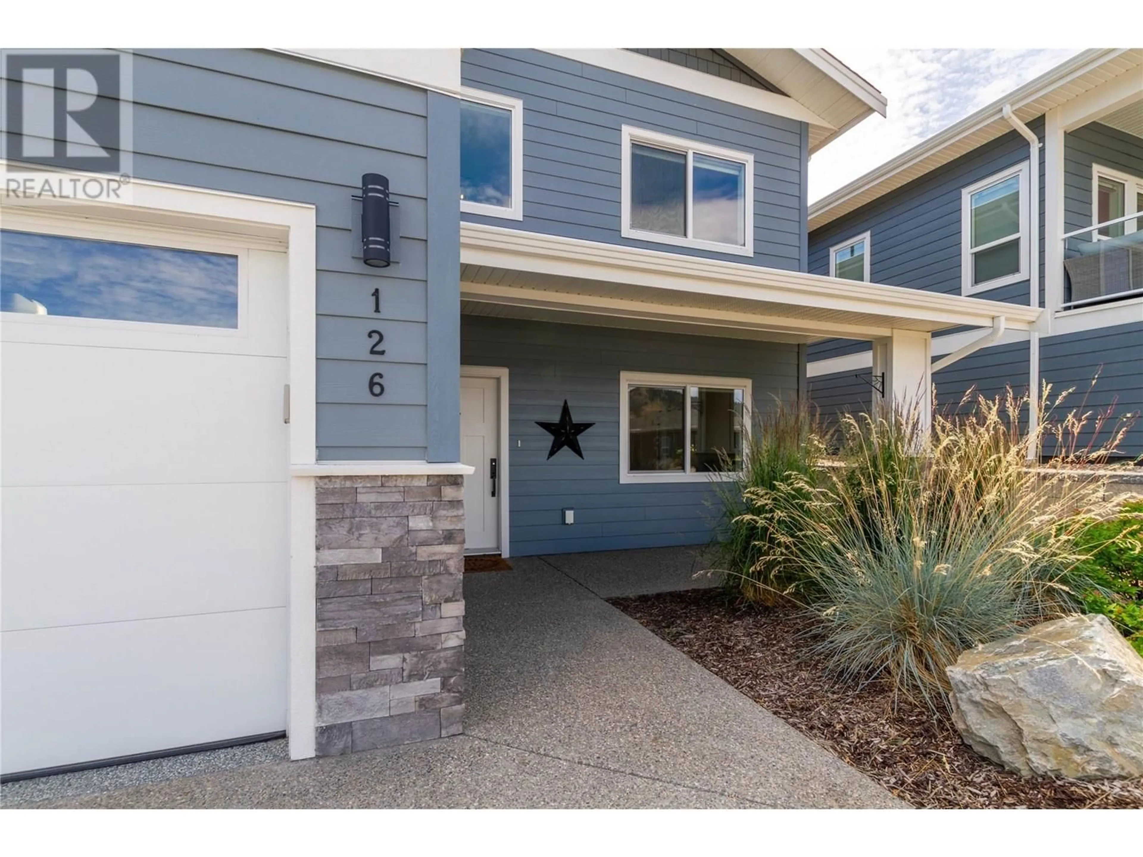 Home with vinyl exterior material, street for 126 - 7760 OKANAGAN LANDING ROAD, Vernon British Columbia V1H1Z4