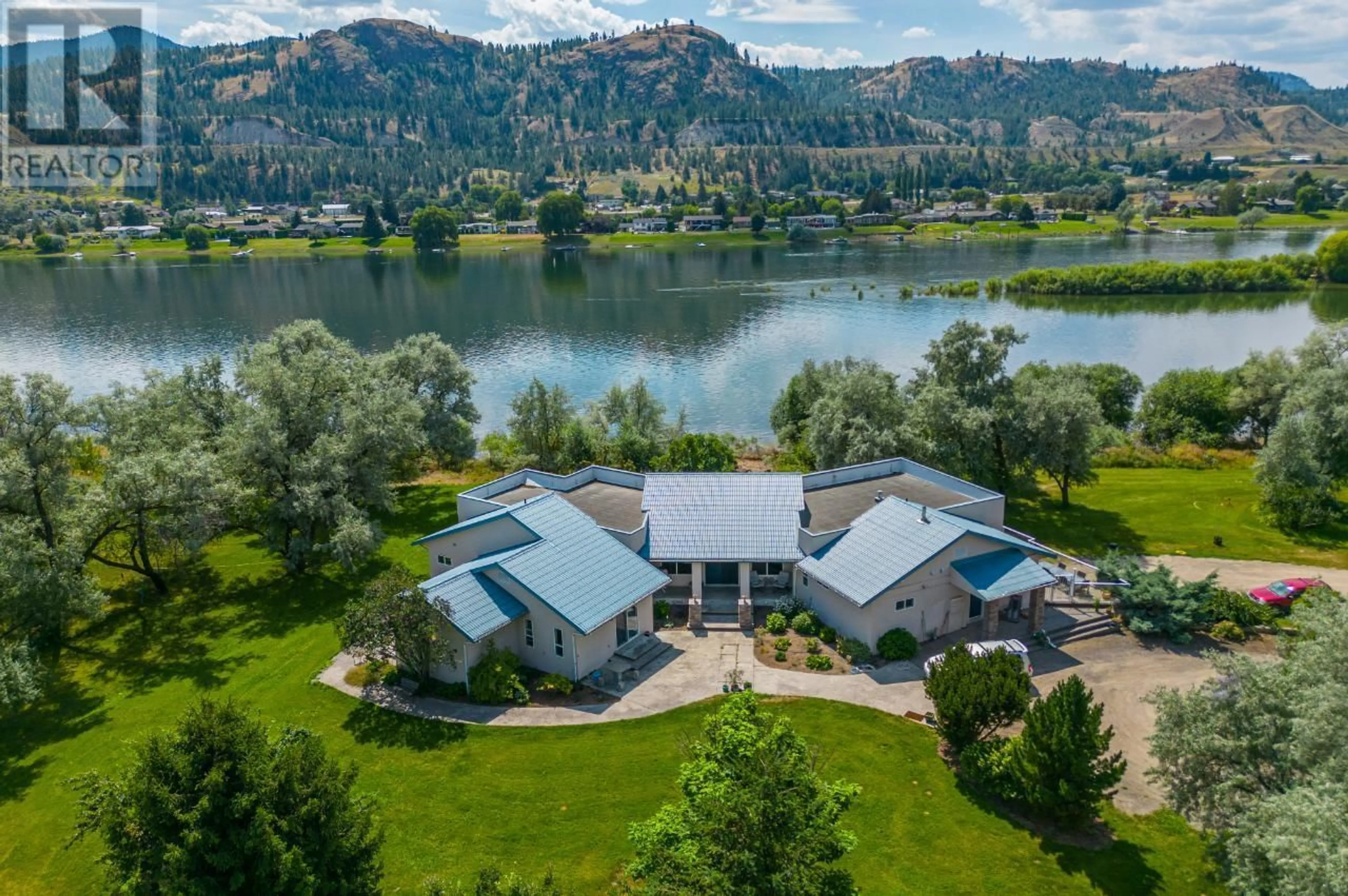 A pic from outside/outdoor area/front of a property/back of a property/a pic from drone, water/lake/river/ocean view for 3390 SHUSWAP  E ROAD, Kamloops British Columbia V2H1T2