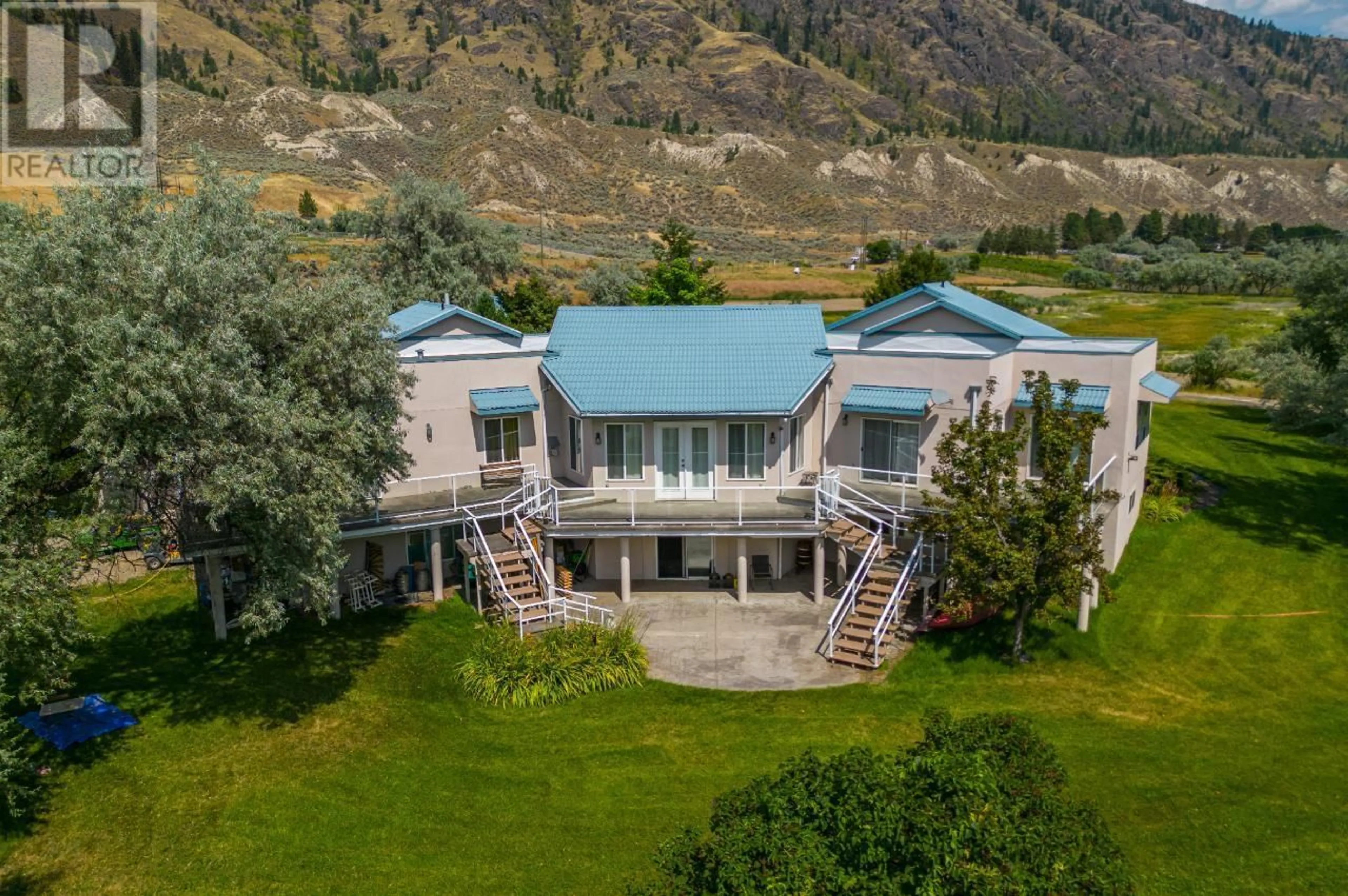A pic from outside/outdoor area/front of a property/back of a property/a pic from drone, mountain view for 3390 SHUSWAP  E ROAD, Kamloops British Columbia V2H1T2