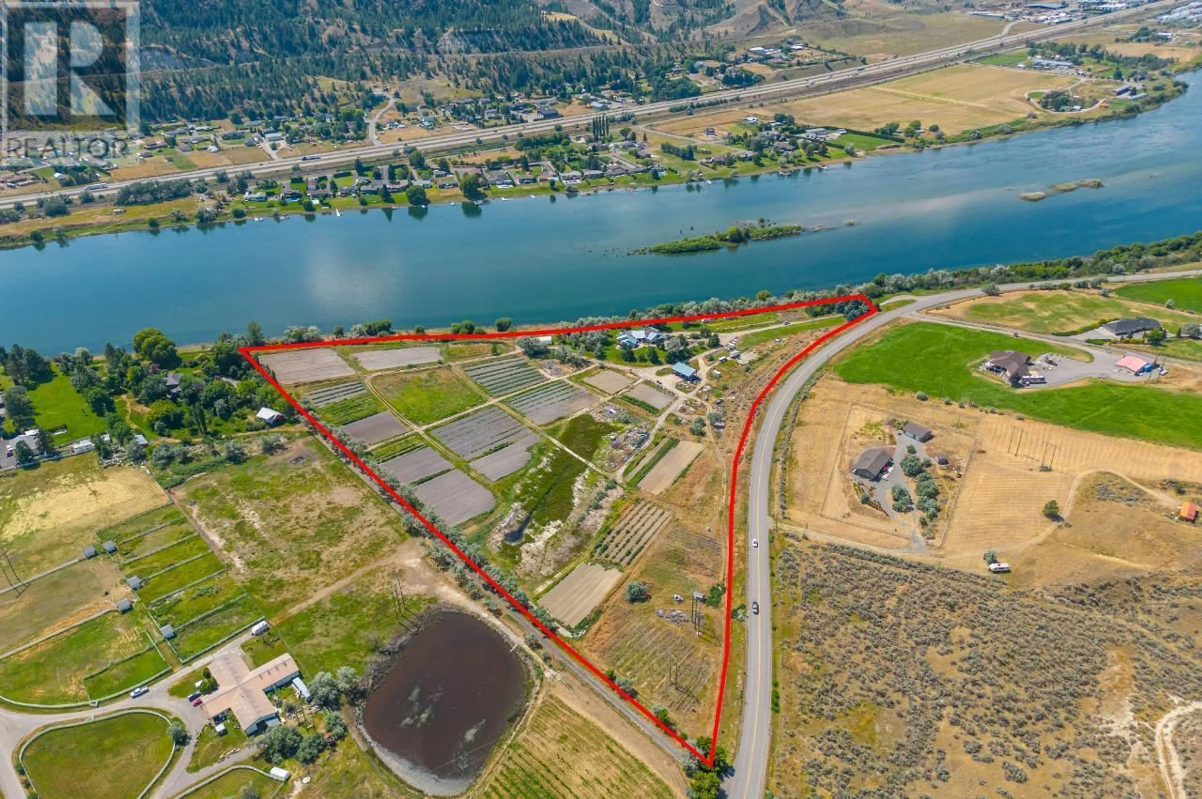 A pic from outside/outdoor area/front of a property/back of a property/a pic from drone, water/lake/river/ocean view for 3390 SHUSWAP  E ROAD, Kamloops British Columbia V2H1T2