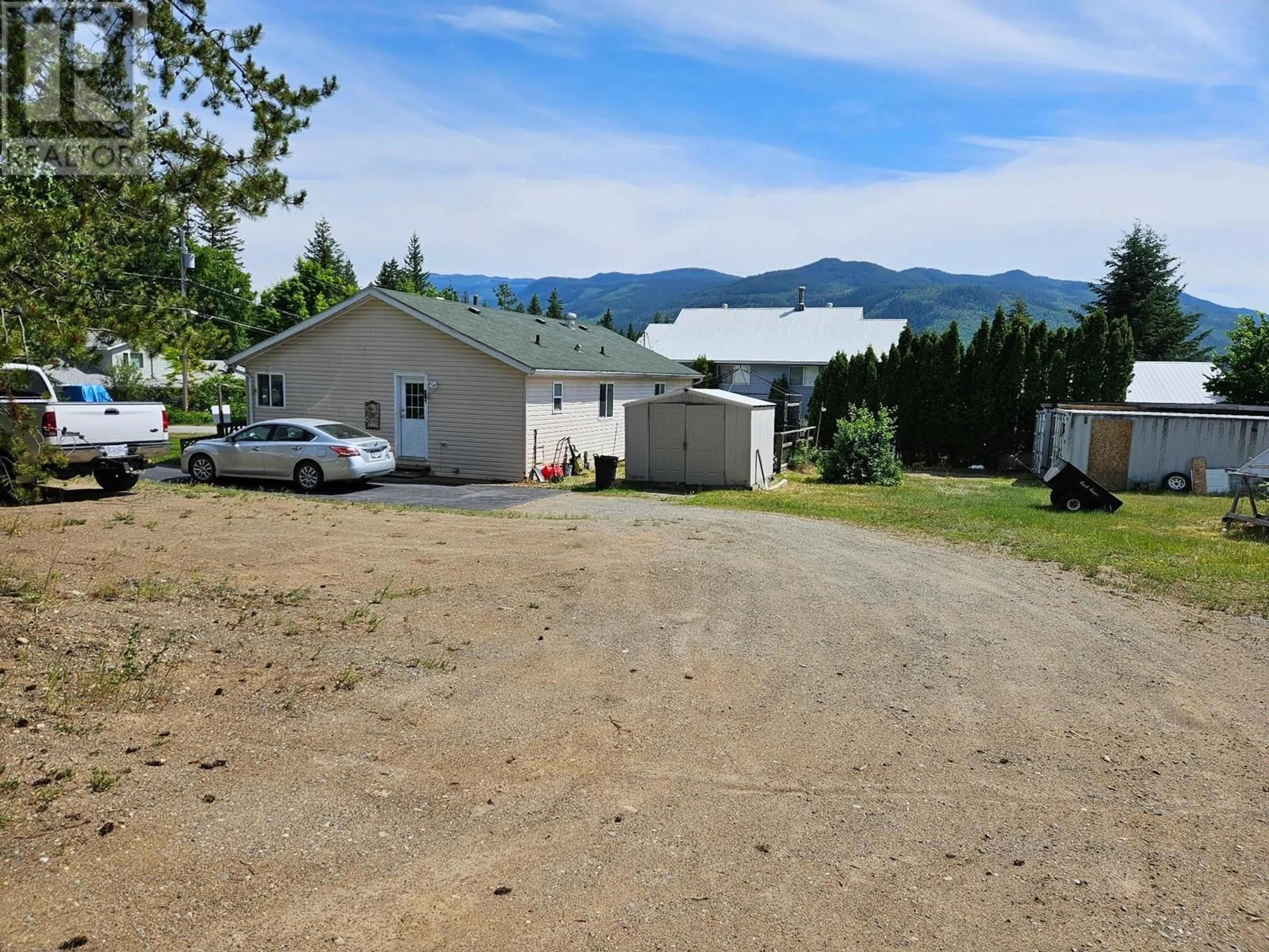 A pic from outside/outdoor area/front of a property/back of a property/a pic from drone, mountain view for 589 FAWN ROAD, 100 Mile House British Columbia V0E1N1