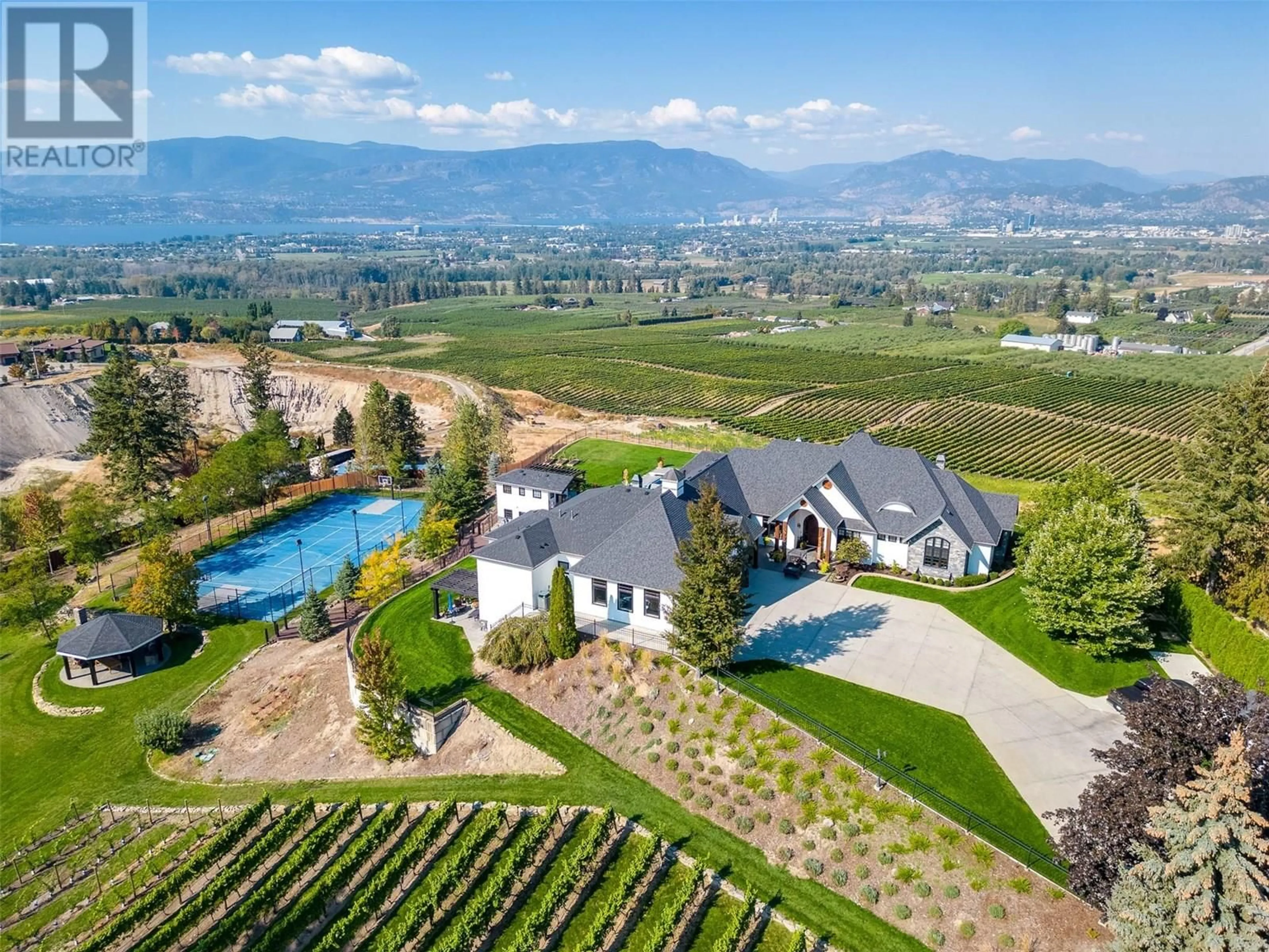 A pic from outside/outdoor area/front of a property/back of a property/a pic from drone, mountain view for 3960 TODD ROAD, Kelowna British Columbia V1W4B3