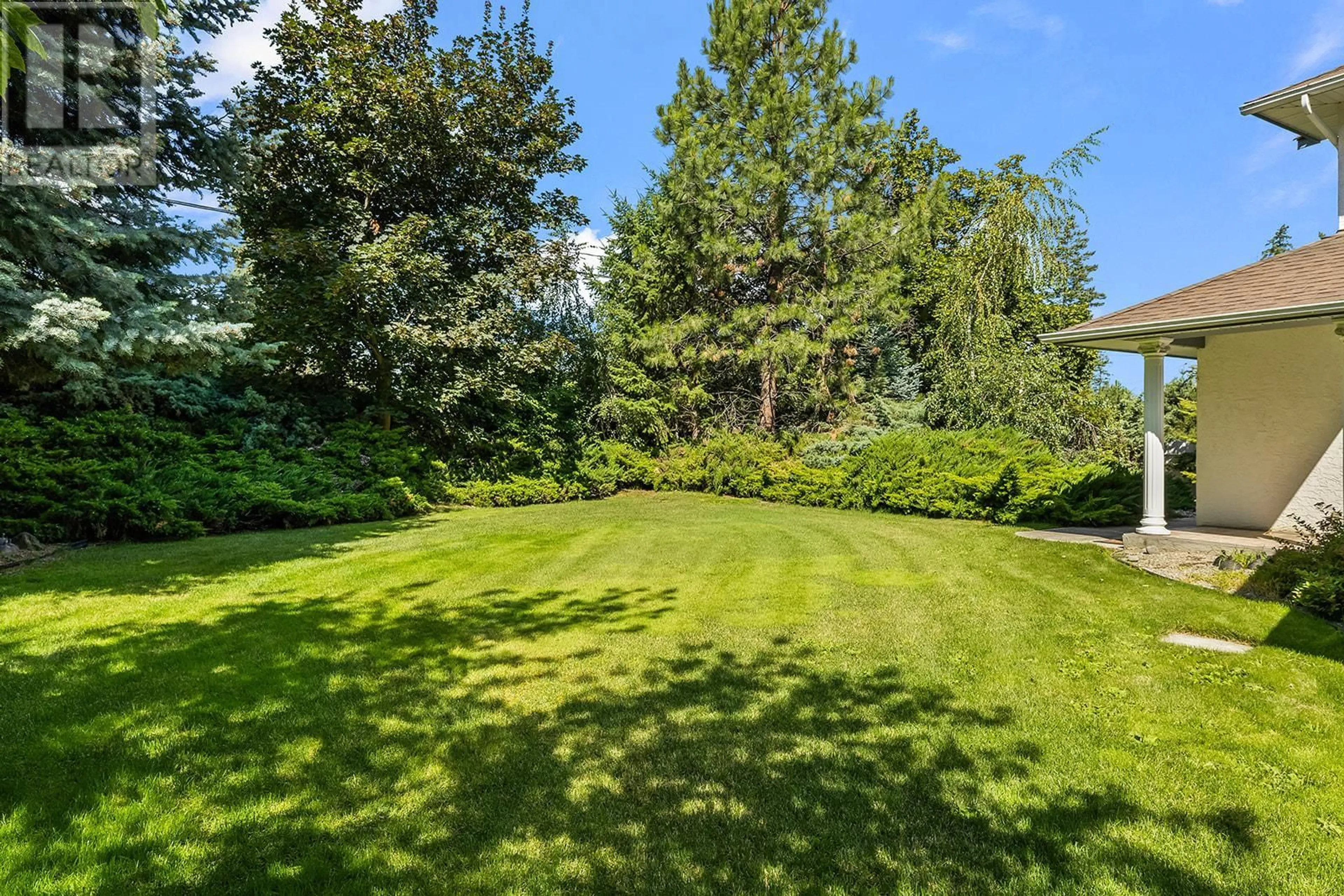 Patio, forest/trees view for 2595 MAQUINNA ROAD, Kelowna British Columbia V1W2R9