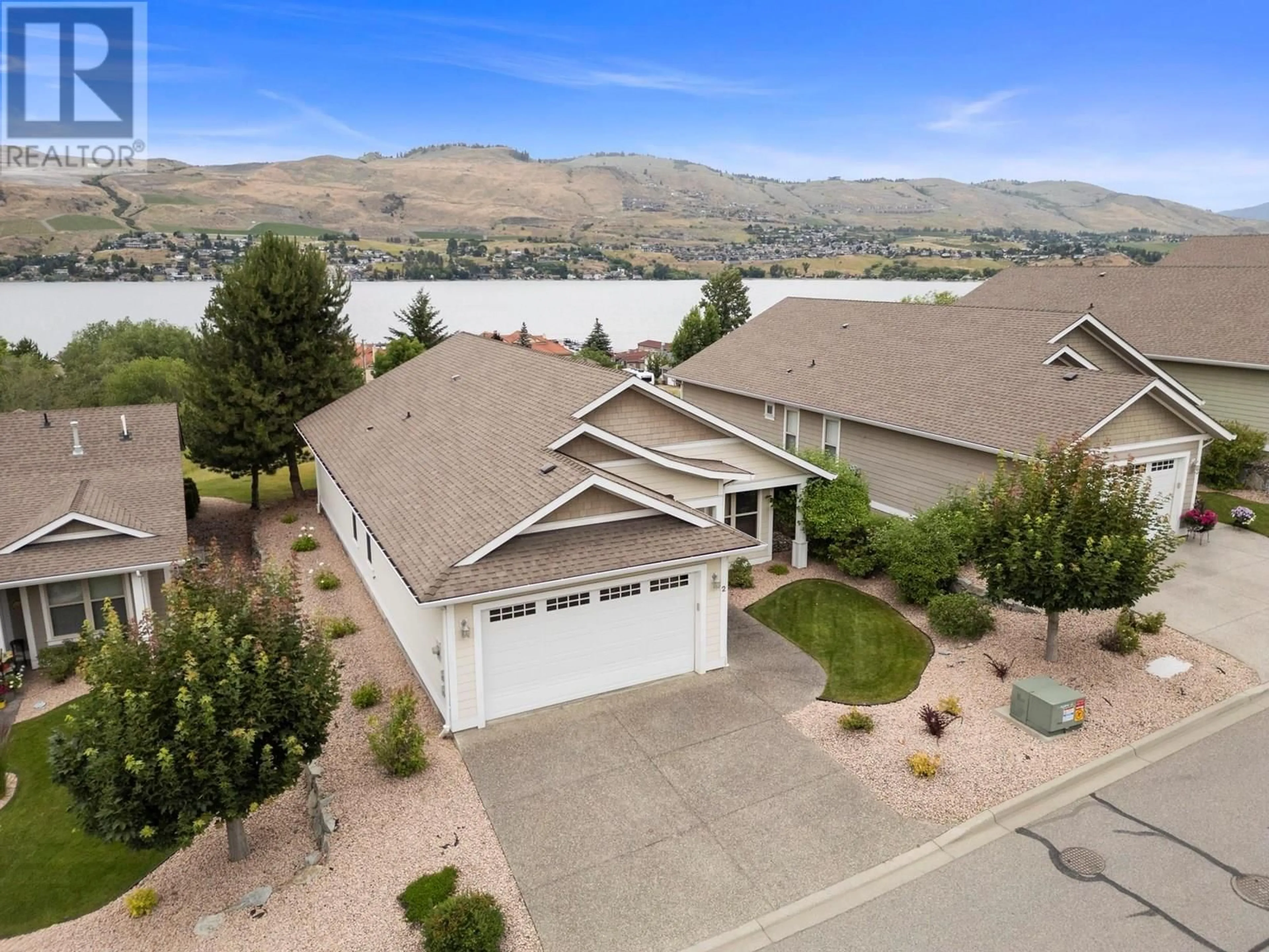 A pic from outside/outdoor area/front of a property/back of a property/a pic from drone, water/lake/river/ocean view for 2 - 7760 OKANAGAN LANDING ROAD, Vernon British Columbia V1H1Z4