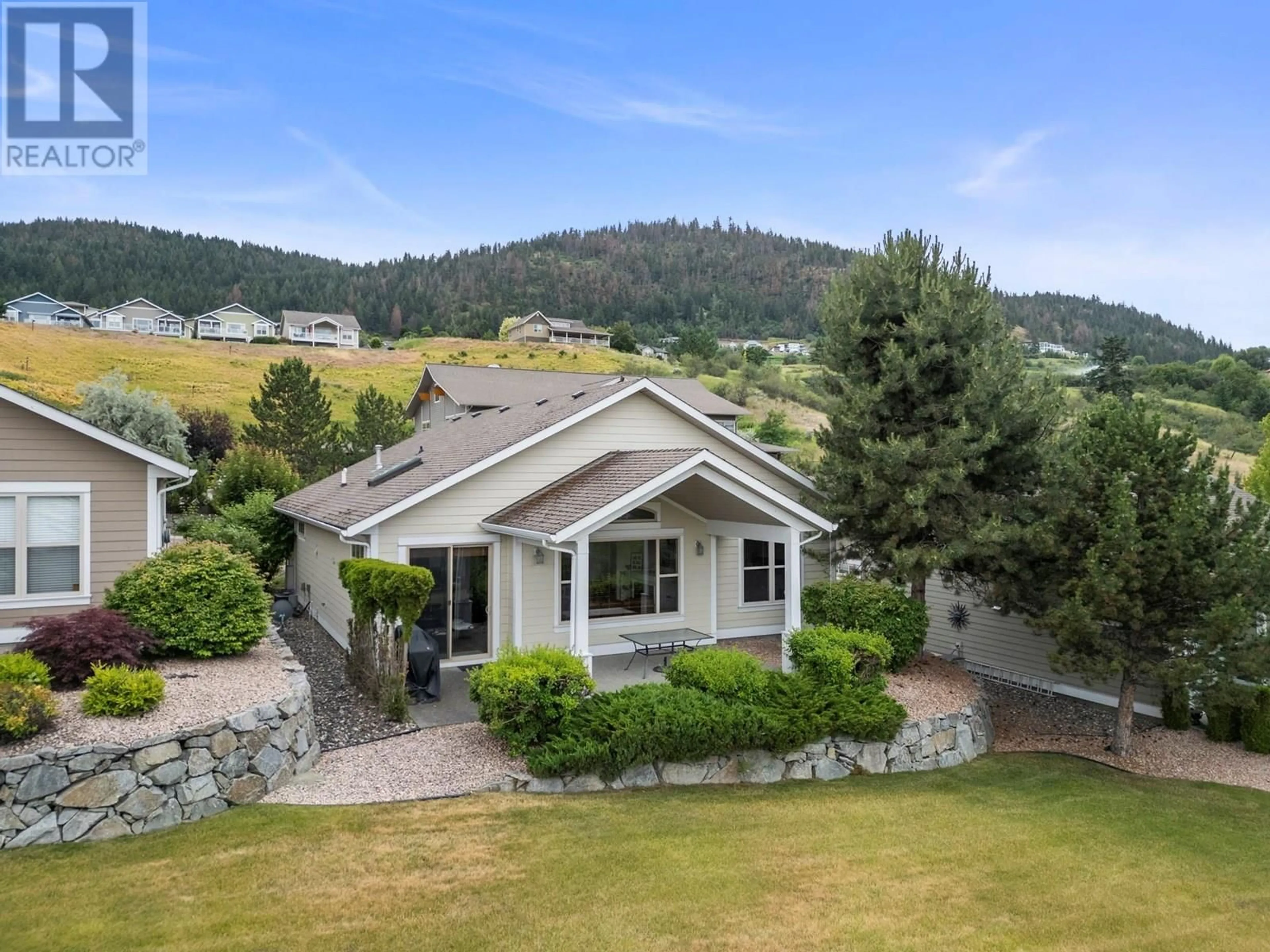 A pic from outside/outdoor area/front of a property/back of a property/a pic from drone, mountain view for 2 - 7760 OKANAGAN LANDING ROAD, Vernon British Columbia V1H1Z4