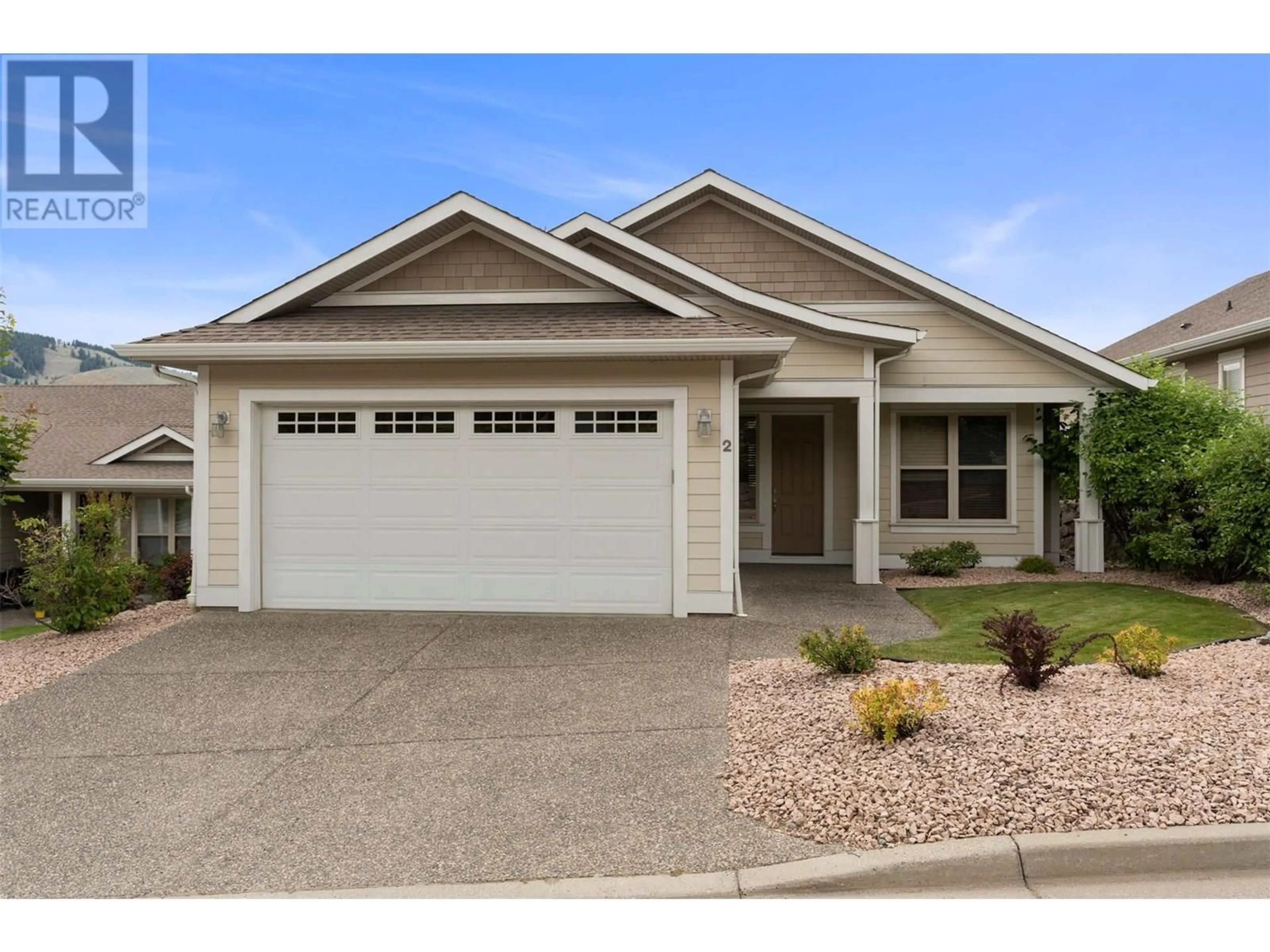 Home with vinyl exterior material, street for 2 - 7760 OKANAGAN LANDING ROAD, Vernon British Columbia V1H1Z4