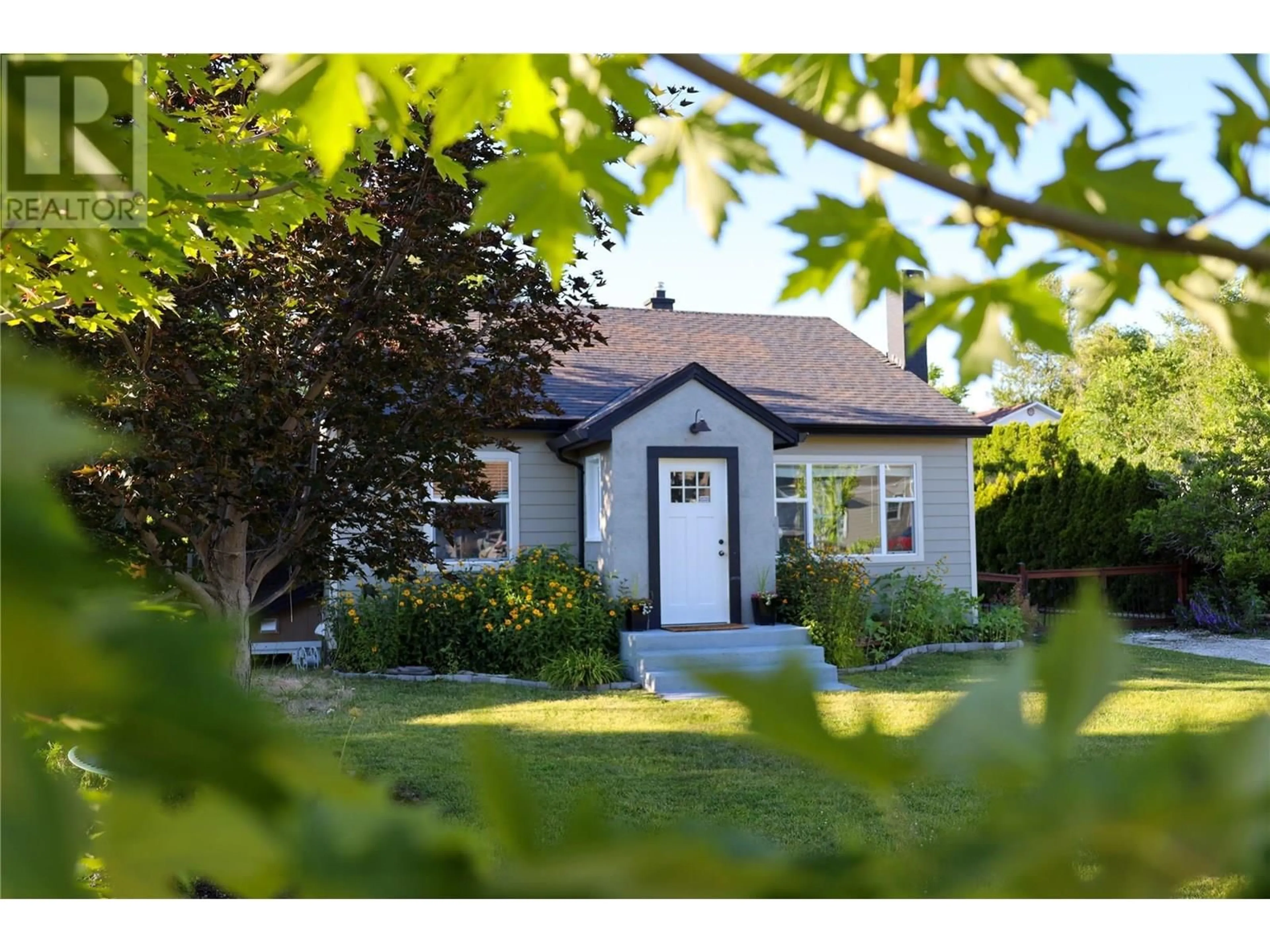 Home with vinyl exterior material, street for 9718 JULIA STREET, Summerland British Columbia V0H1Z6