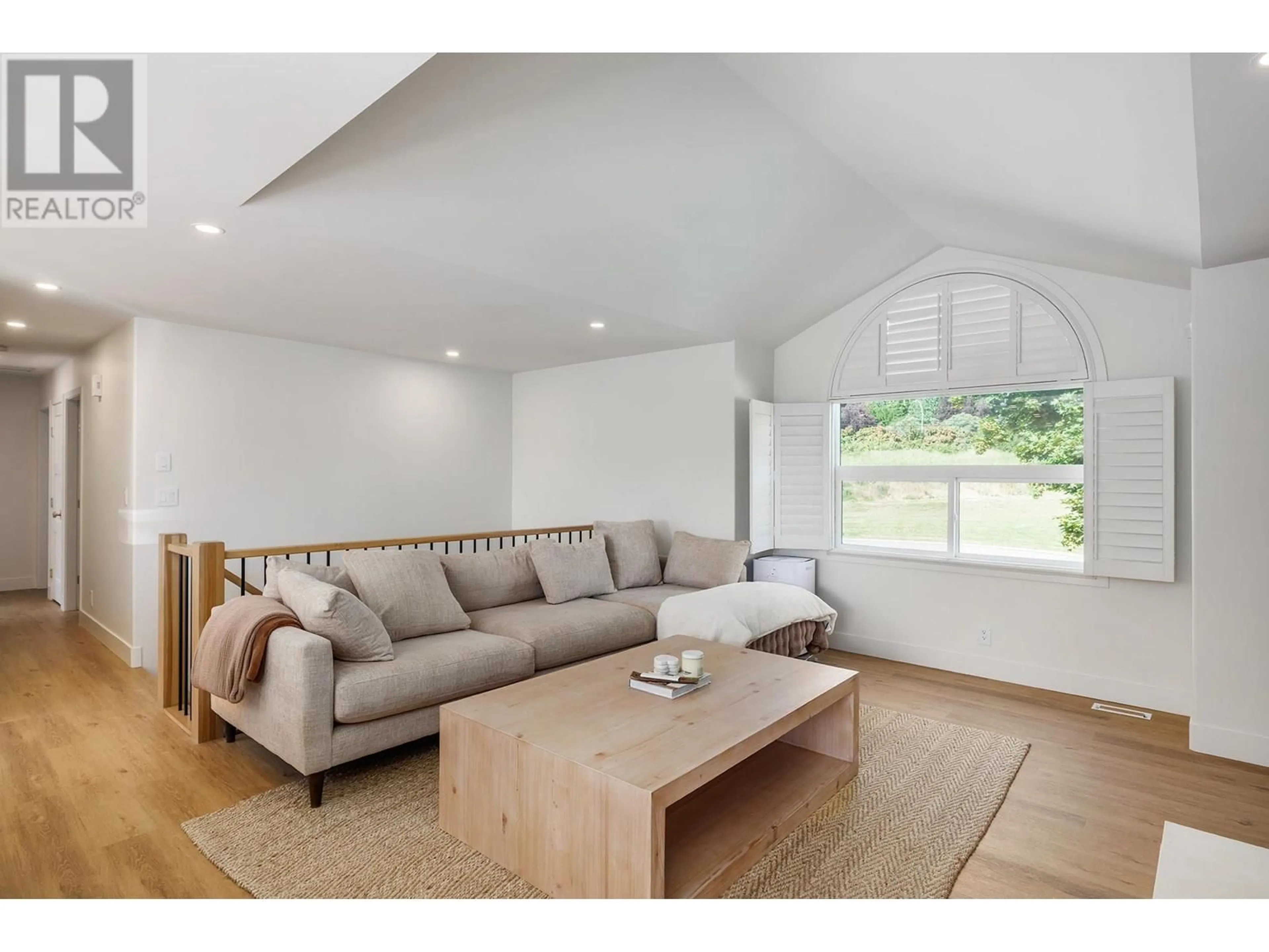 Living room with furniture, wood/laminate floor for 3617 GLEN ABBEY COURT, West Kelowna British Columbia V4T2N1