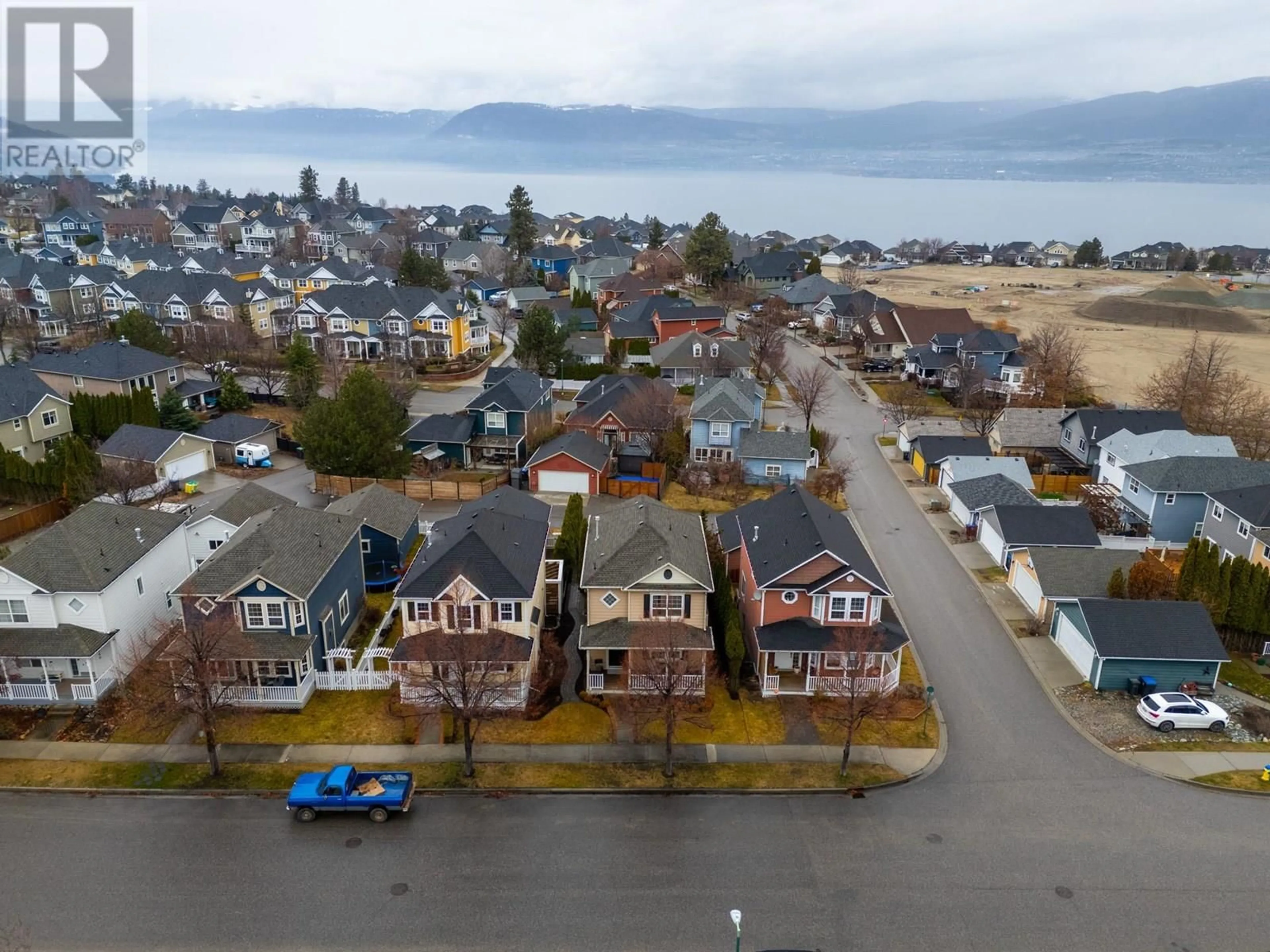 A pic from outside/outdoor area/front of a property/back of a property/a pic from drone, street for 396 MCCARREN AVENUE, Kelowna British Columbia V1W4W3