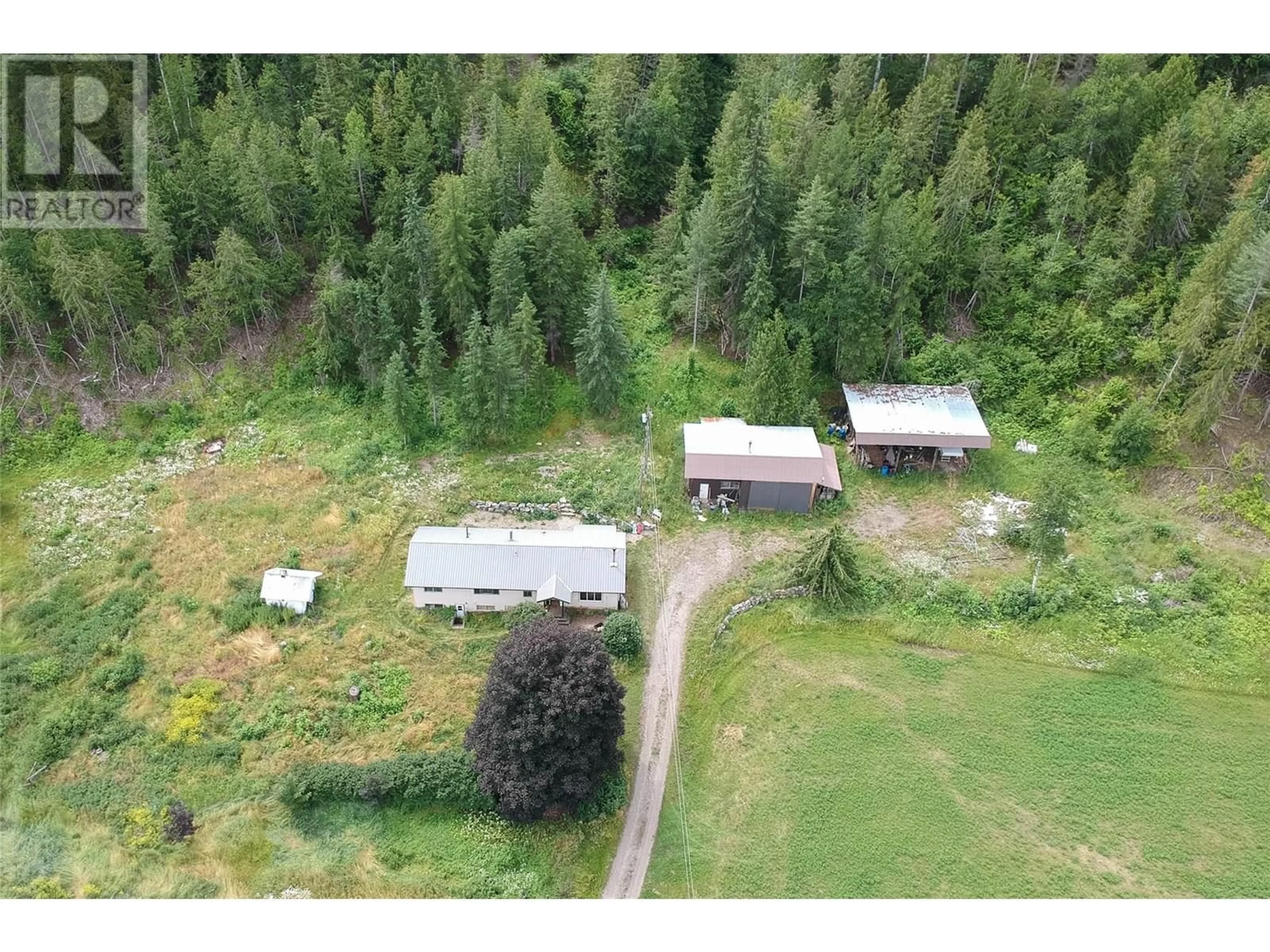 A pic from outside/outdoor area/front of a property/back of a property/a pic from drone, forest/trees view for 1538 HIGHWAY 6 OTHER, Cherryville British Columbia V0E2G1