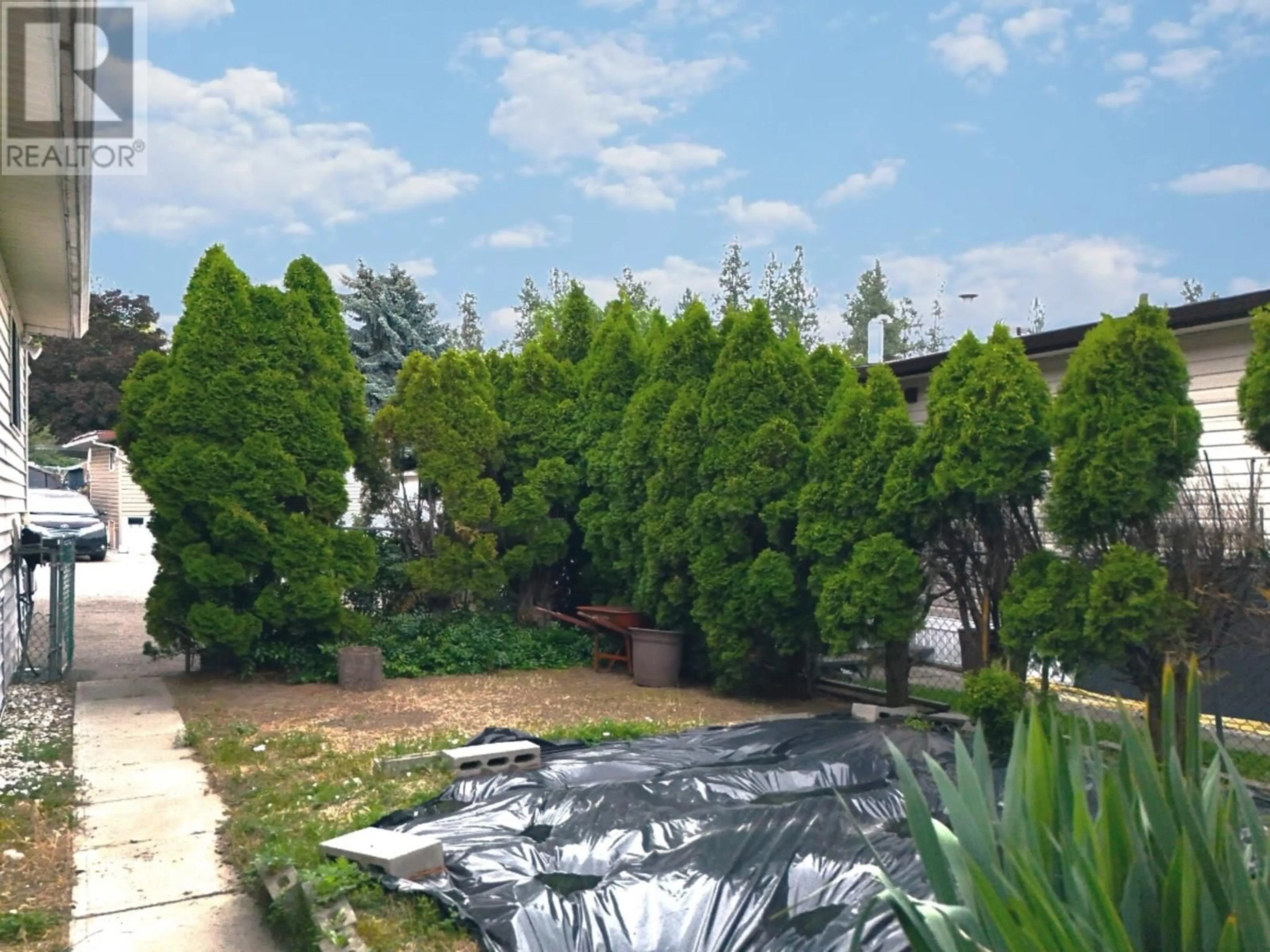 A pic from outside/outdoor area/front of a property/back of a property/a pic from drone, unknown for 197 - 1999 97 HIGHWAY, Kelowna British Columbia V1Z1B2