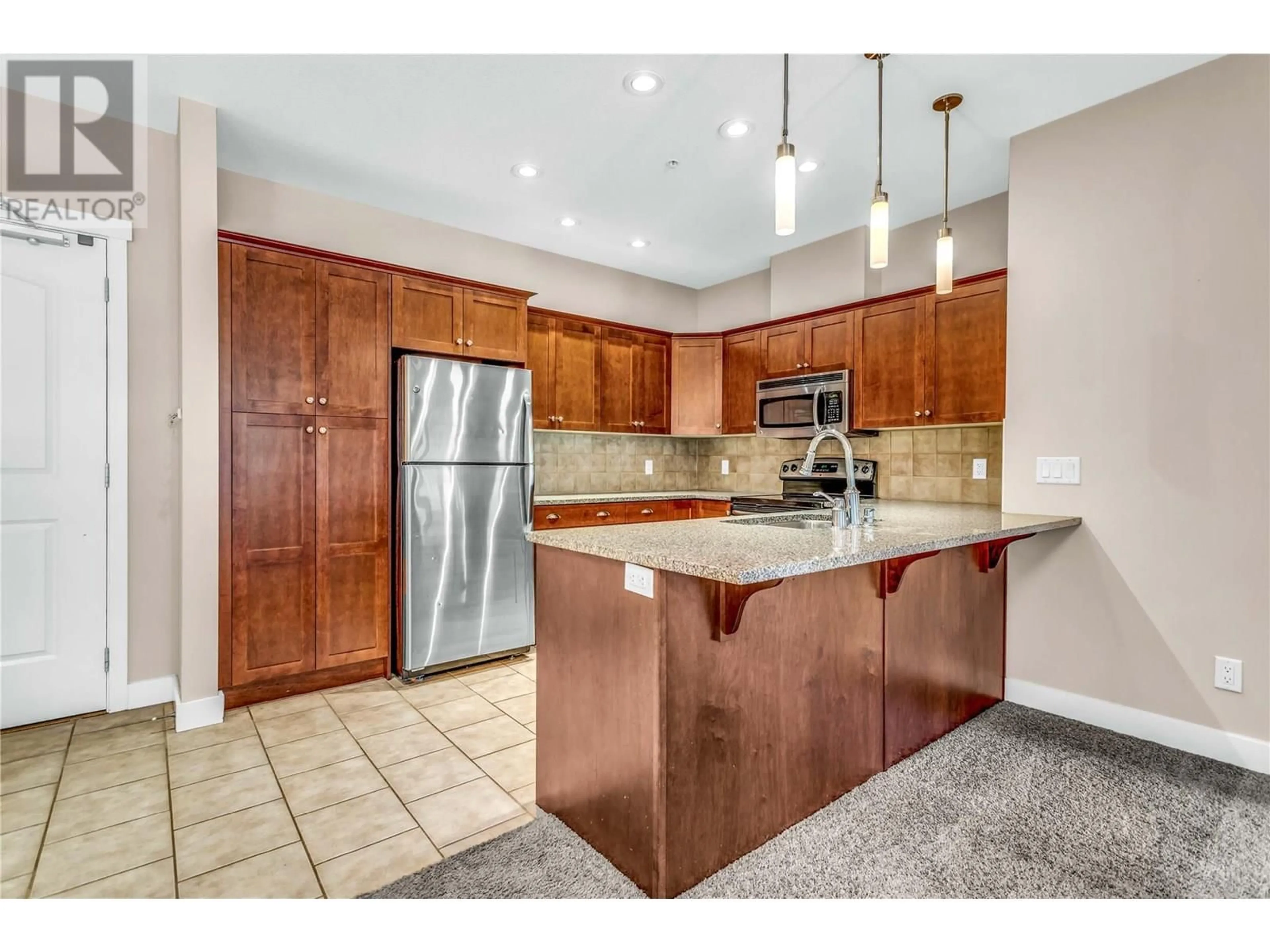 Open concept kitchen, ceramic/tile floor for 3215 - 1990 UPPER SUNDANCE DRIVE, West Kelowna British Columbia V4T3E7