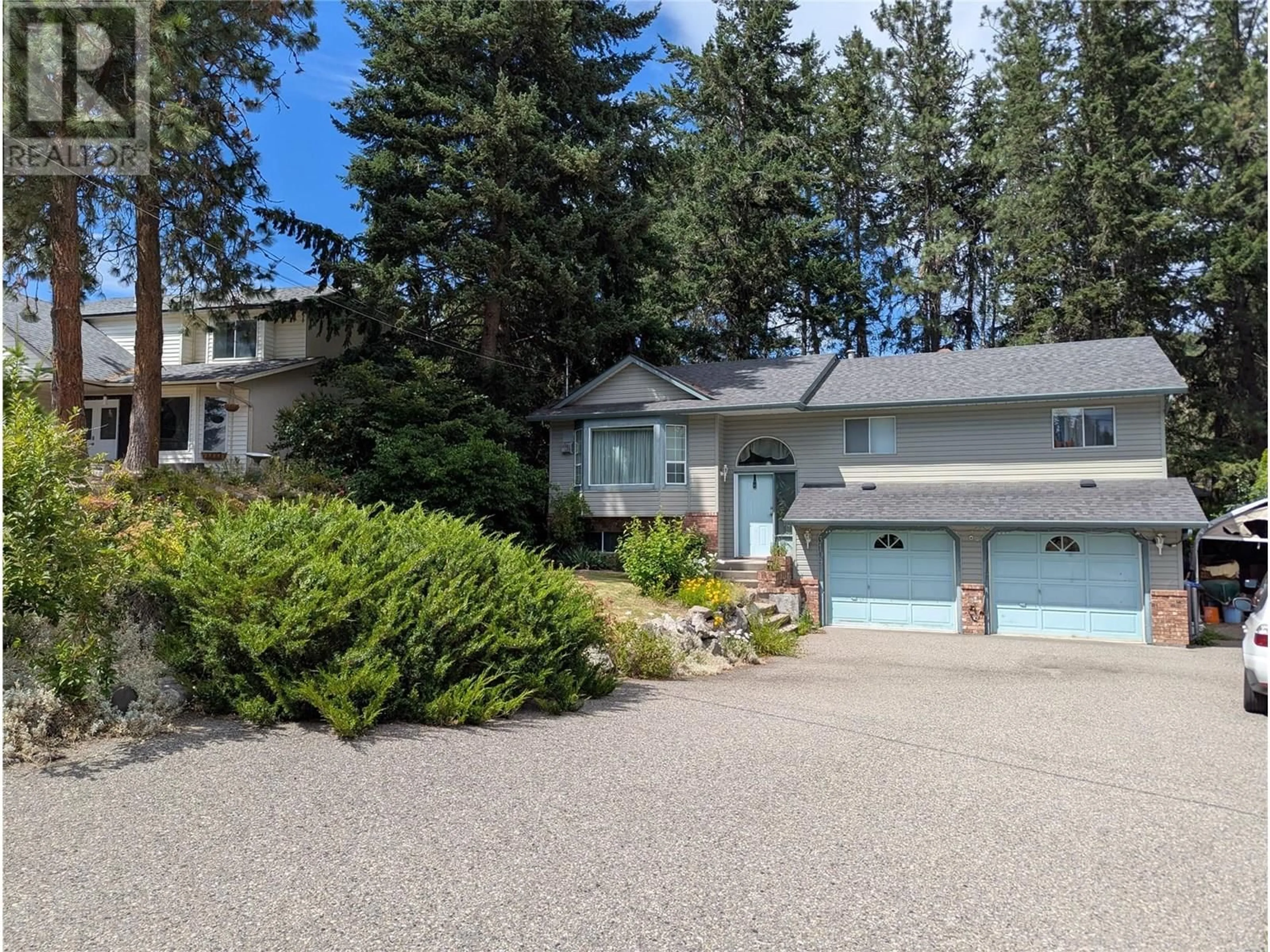 Home with vinyl exterior material, street for 3109 MCIVER ROAD, West Kelowna British Columbia V4T1E6