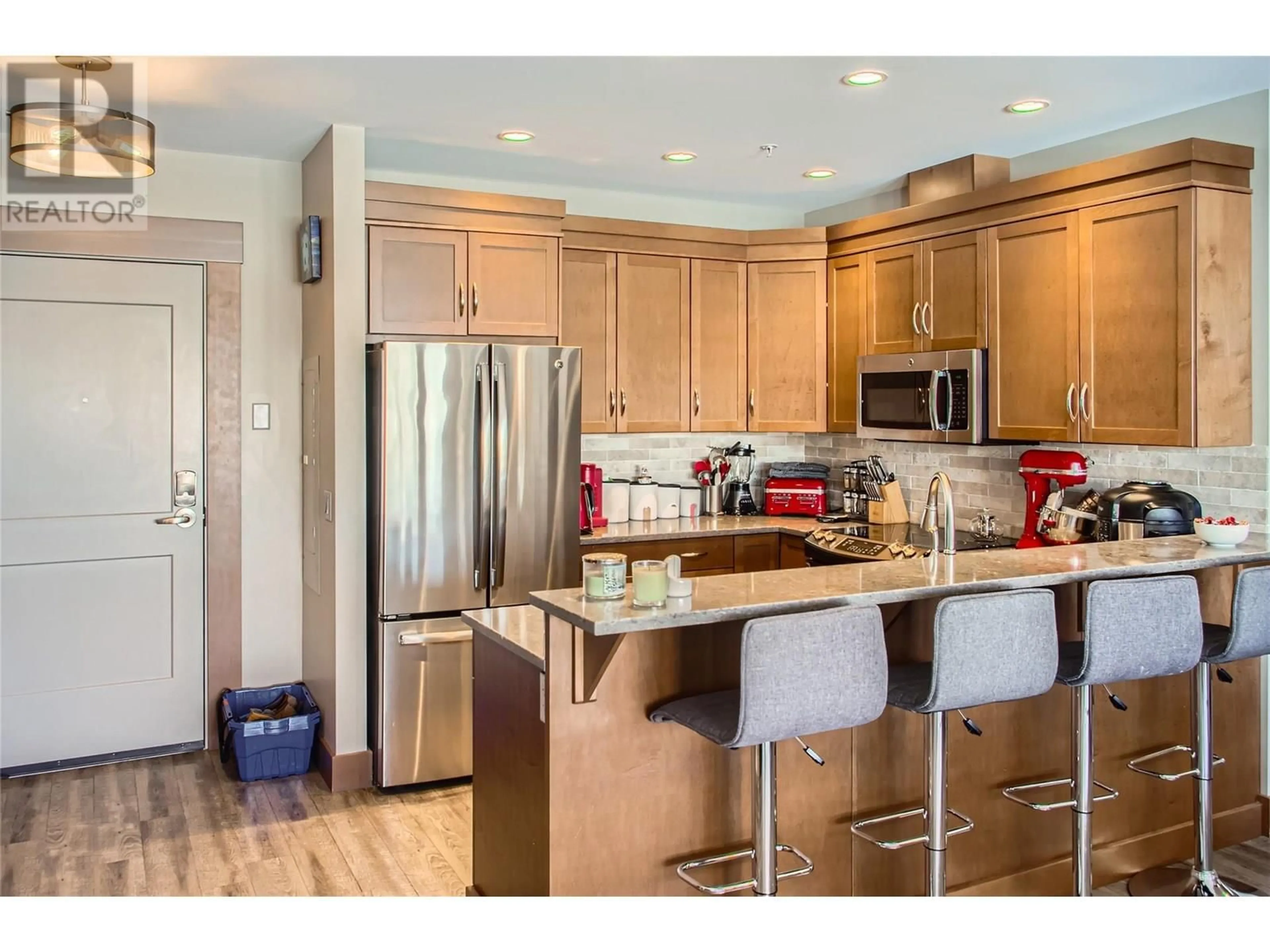Open concept kitchen, wood/laminate floor for 203B - 5300 BIG WHITE ROAD, Big White British Columbia V1P1P3