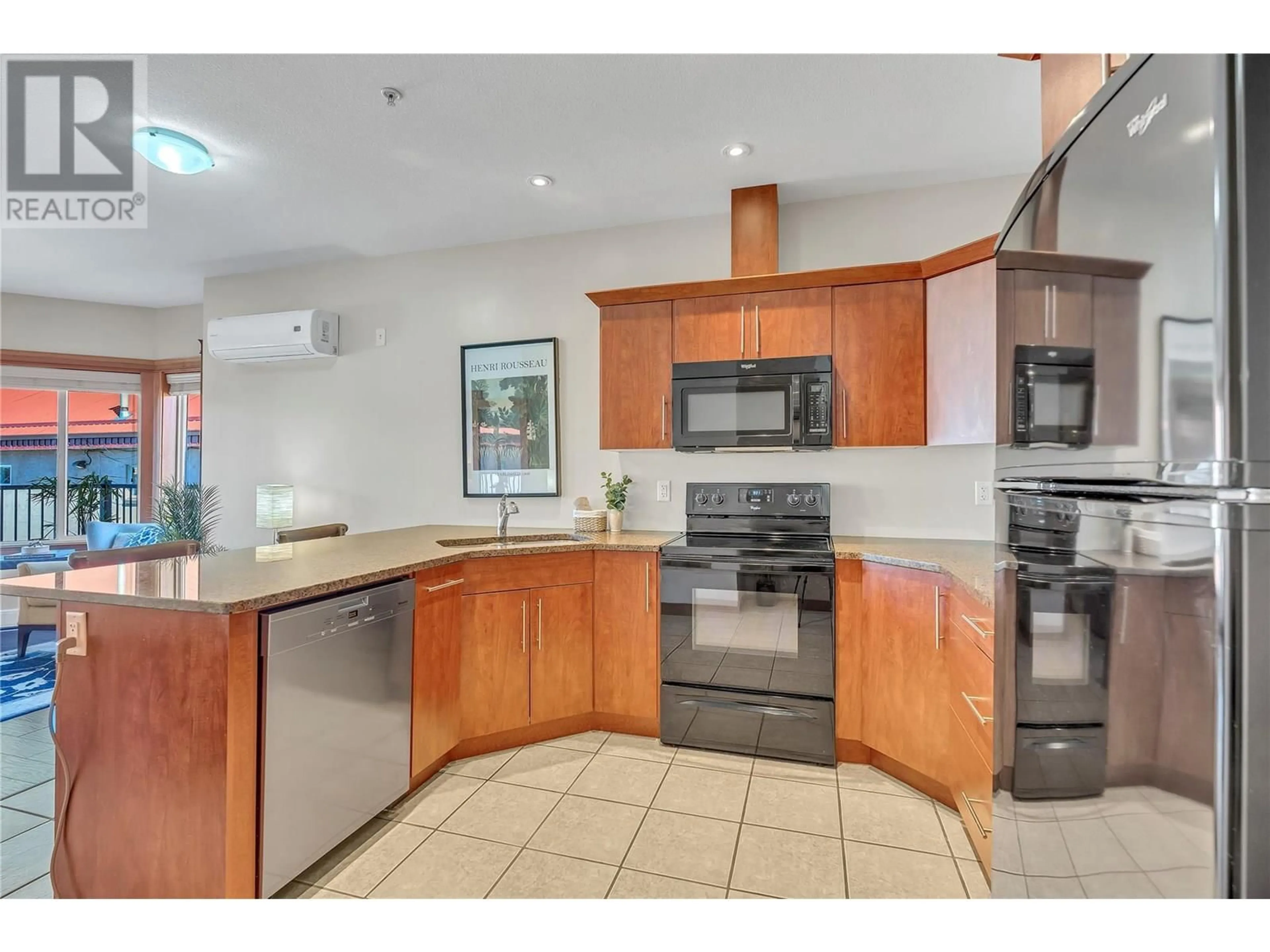 Open concept kitchen, ceramic/tile floor for 203 - 93 WINNIPEG STREET, Penticton British Columbia V2A5L9