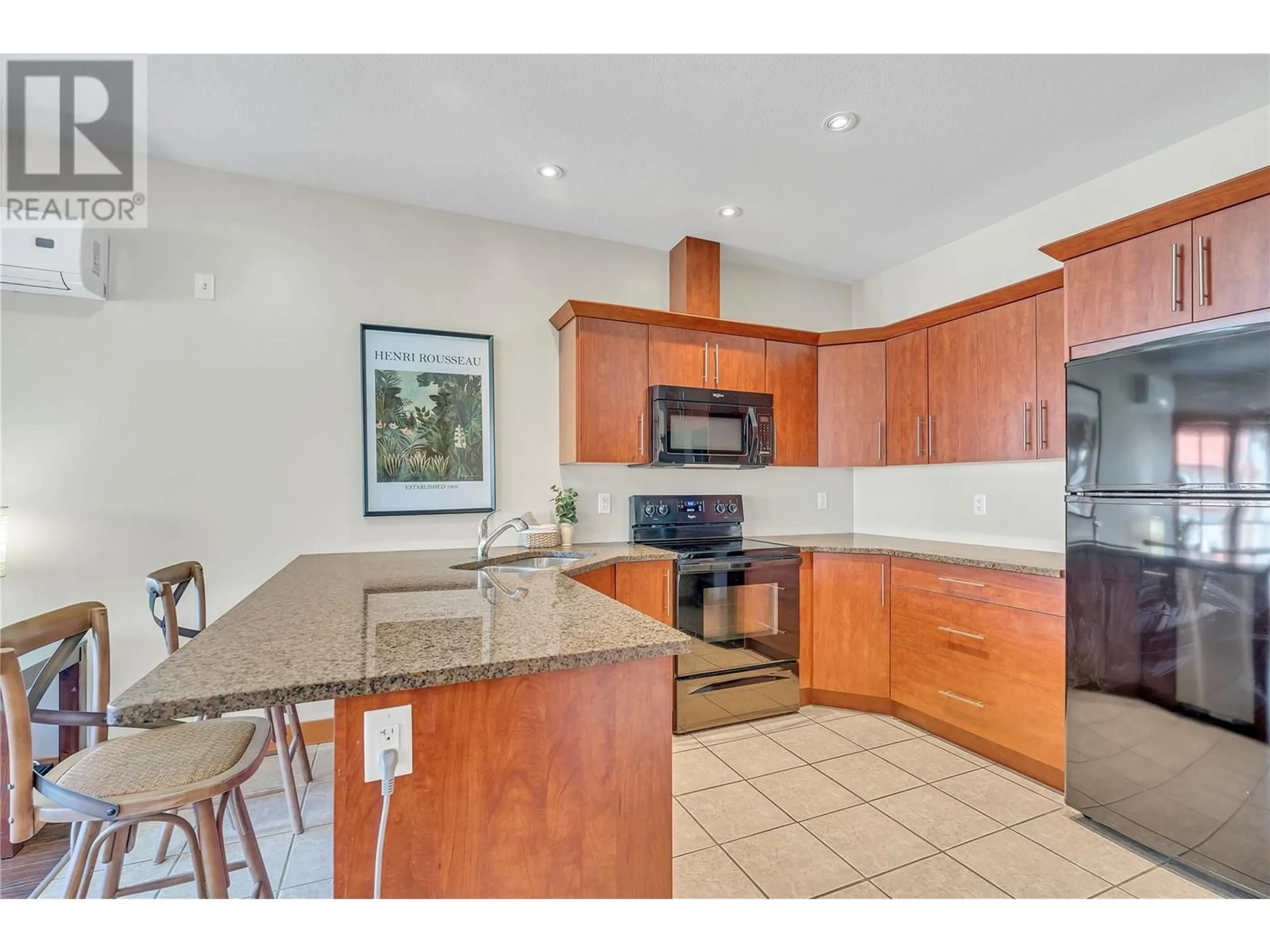 Open concept kitchen, ceramic/tile floor for 203 - 93 WINNIPEG STREET, Penticton British Columbia V2A5L9
