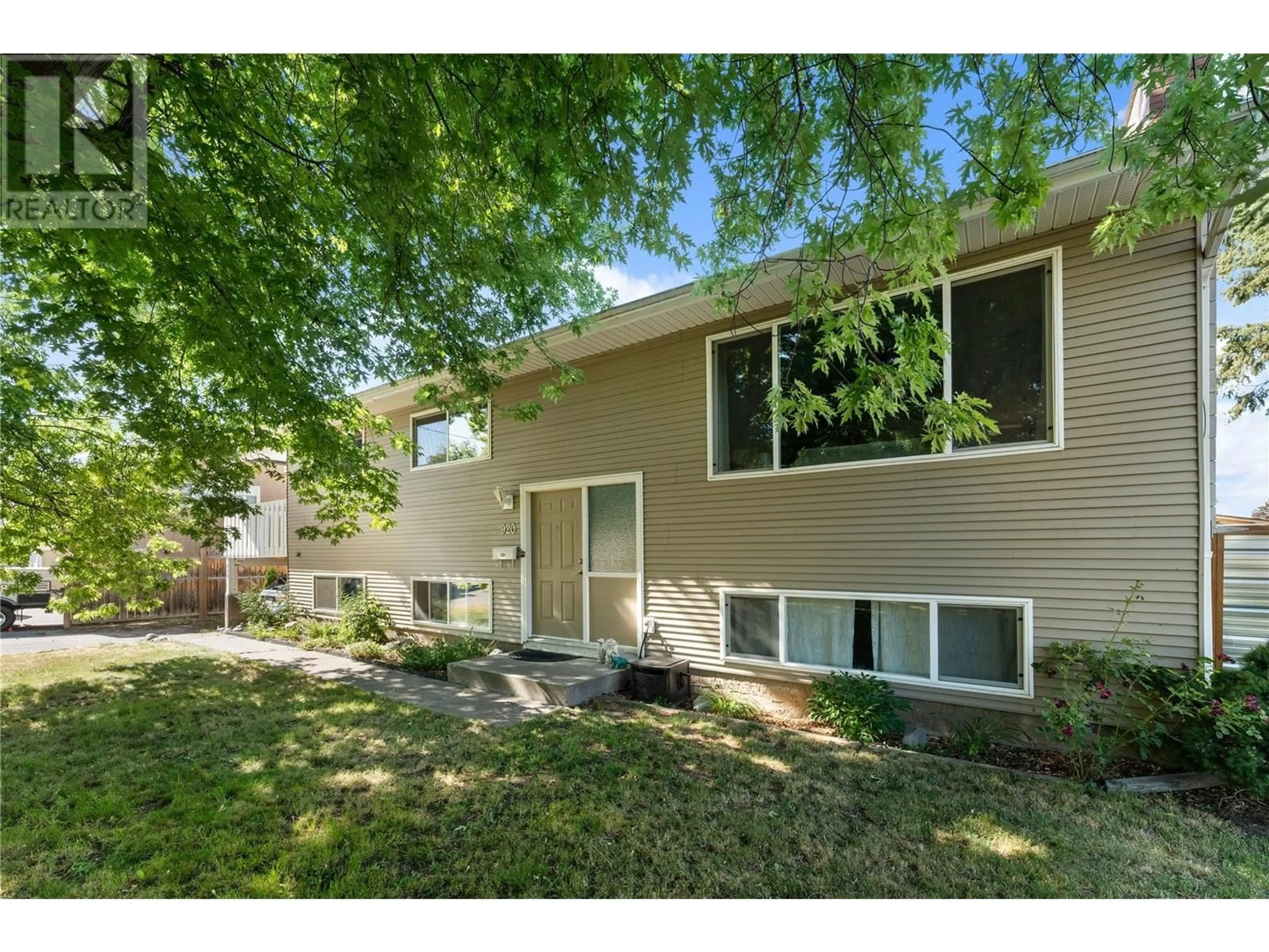 Home with vinyl exterior material, street for 920 BELGO ROAD, Kelowna British Columbia V1X3A7