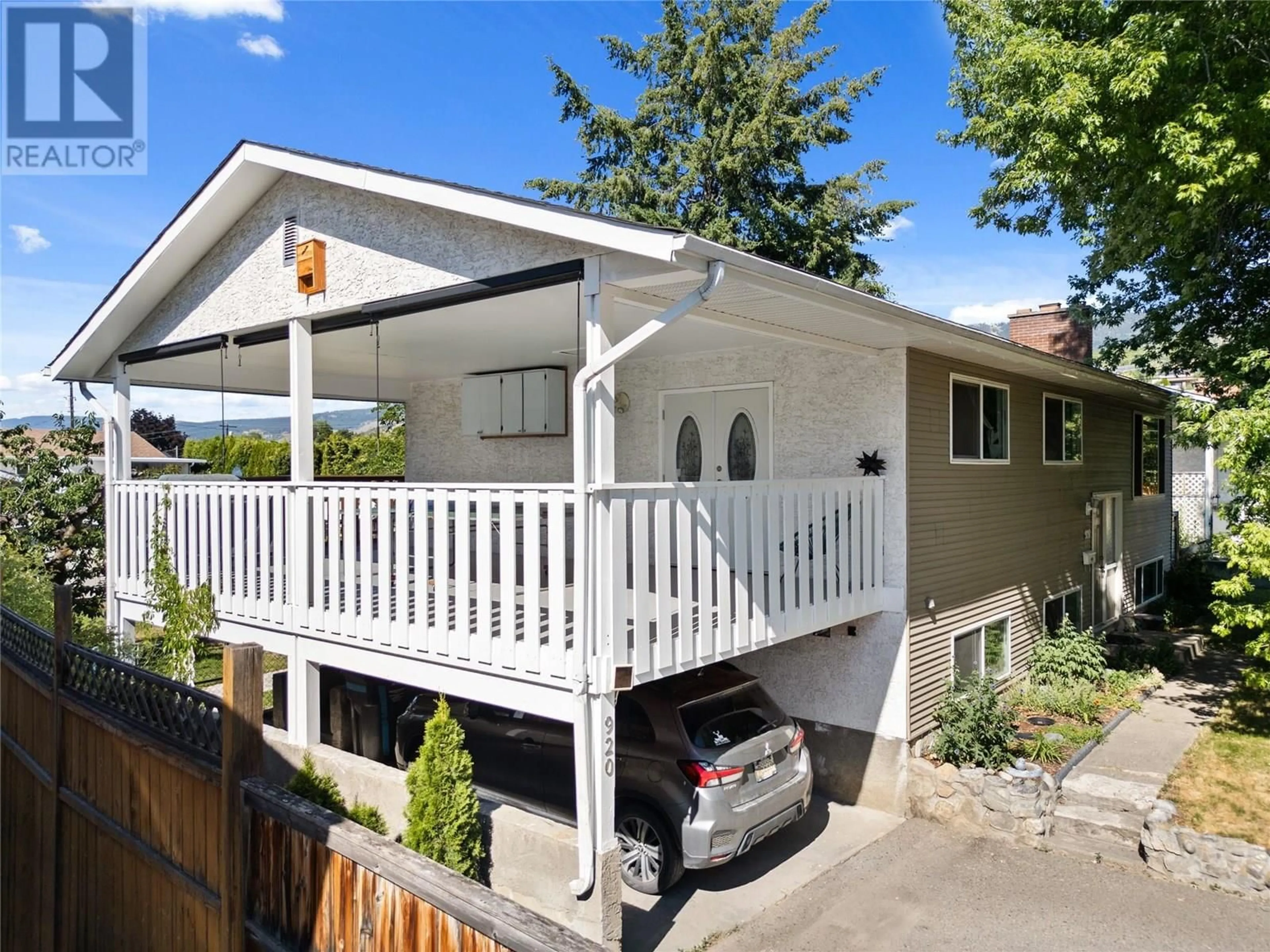Home with vinyl exterior material, street for 920 BELGO ROAD, Kelowna British Columbia V1X3A7