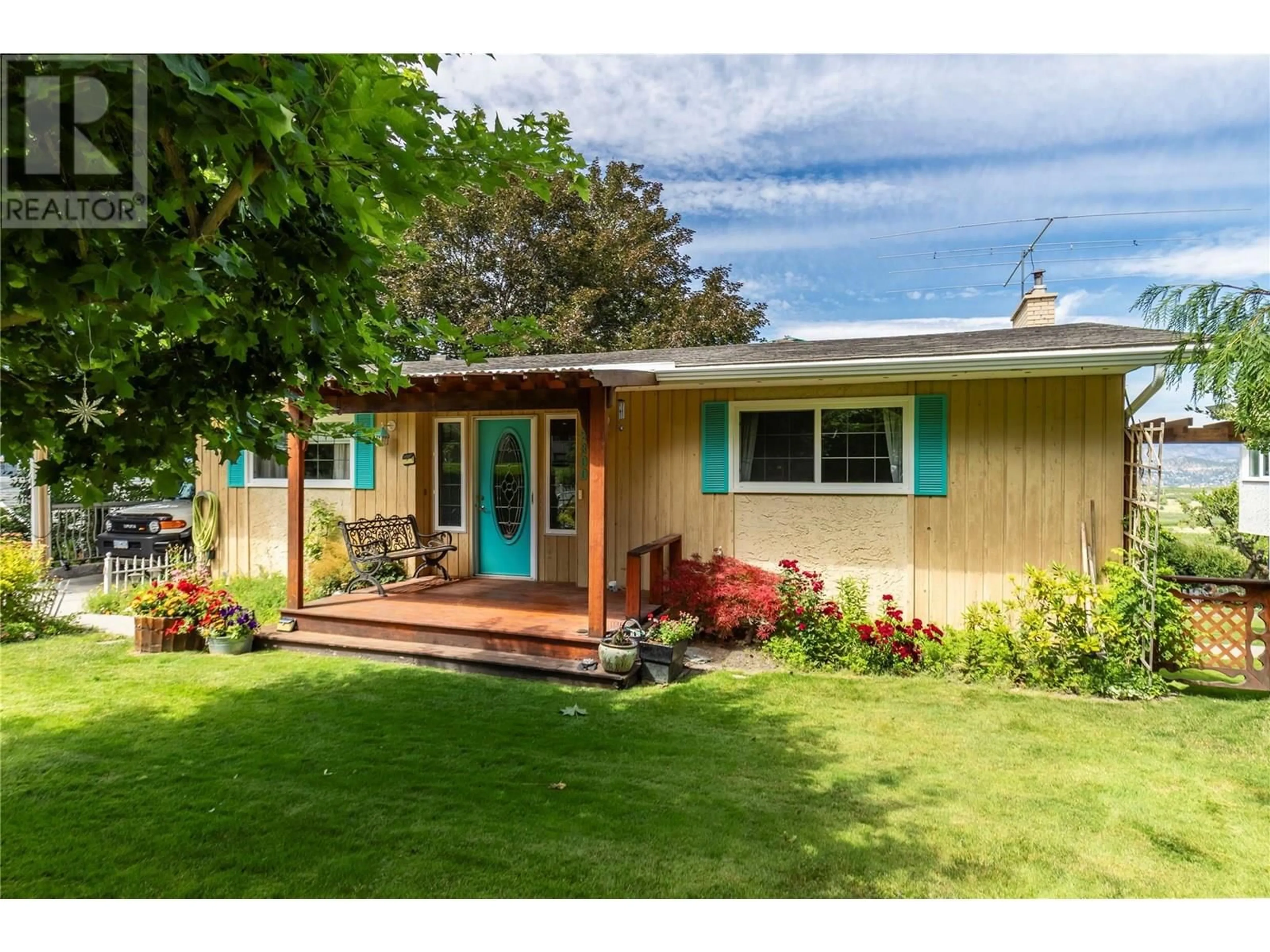 Home with vinyl exterior material, street for 2300 CHARLESWOOD DRIVE, Kelowna British Columbia V1P1E4