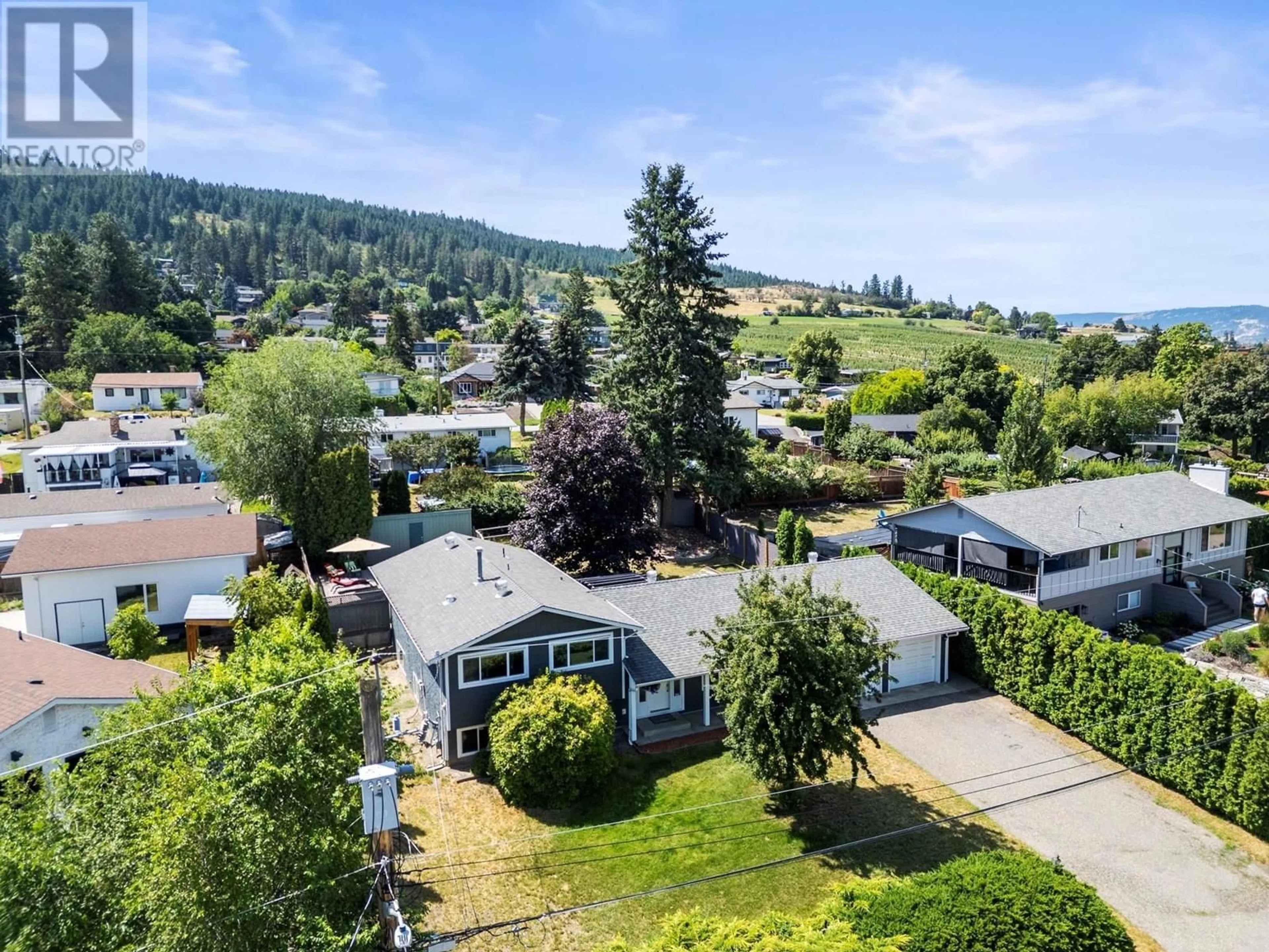 A pic from outside/outdoor area/front of a property/back of a property/a pic from drone, mountain view for 11704 TASSIE DRIVE, Coldstream British Columbia V1B1H5