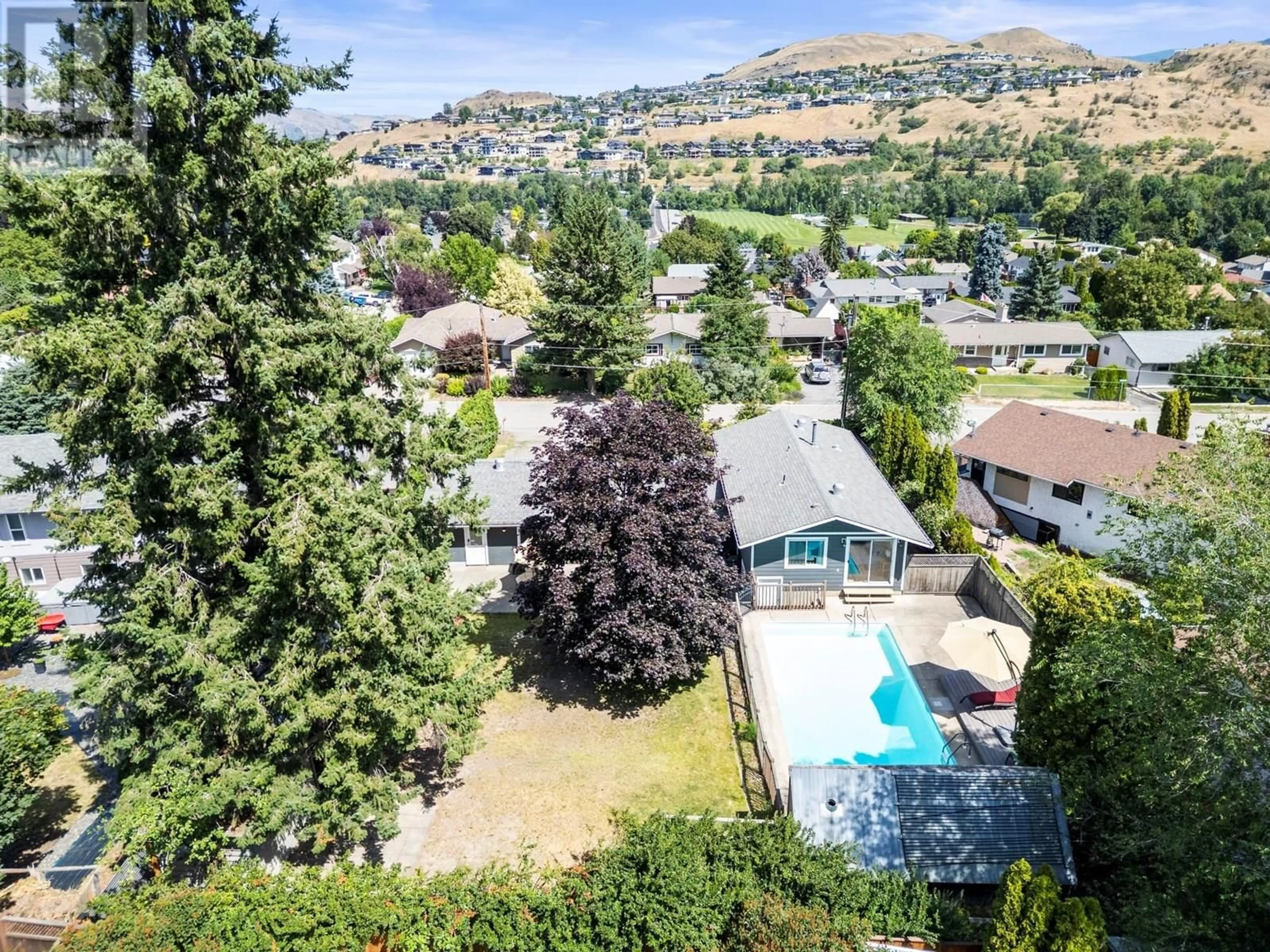 A pic from outside/outdoor area/front of a property/back of a property/a pic from drone, mountain view for 11704 TASSIE DRIVE, Coldstream British Columbia V1B1H5