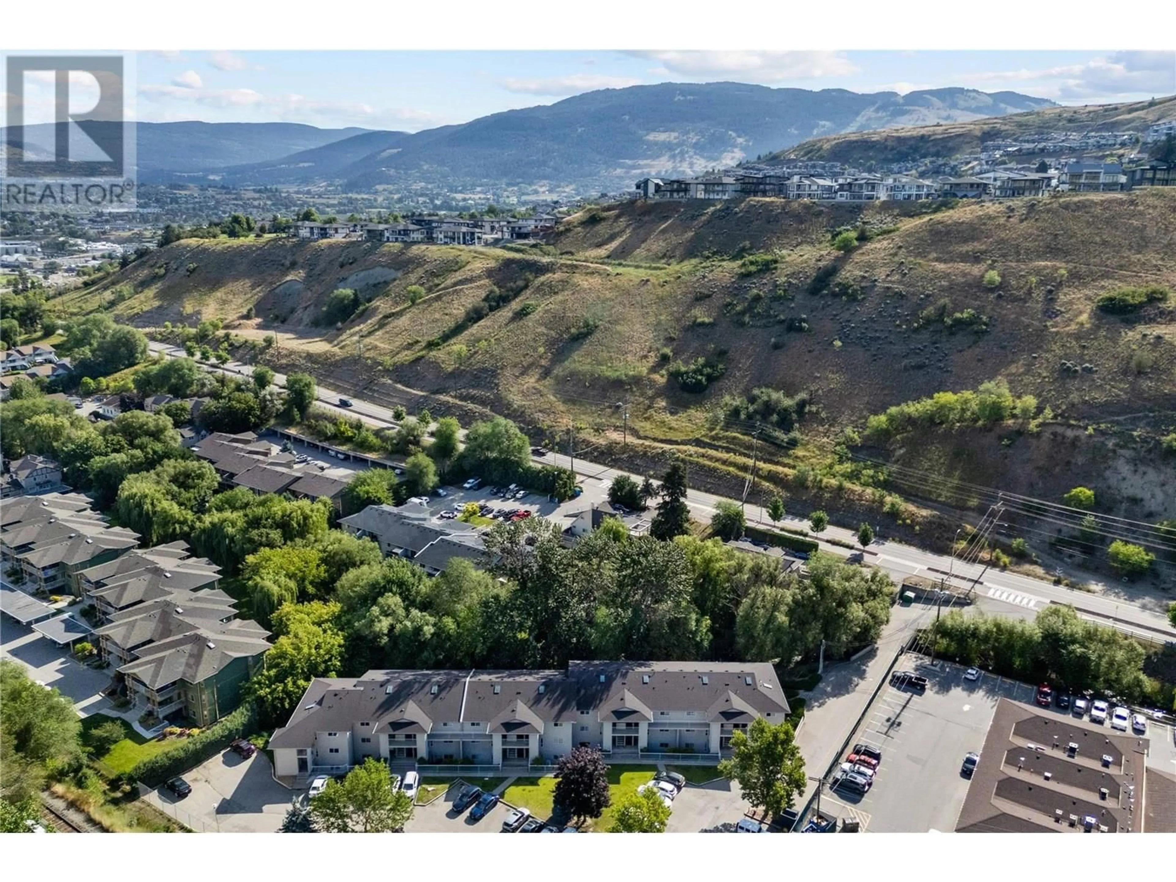 A pic from outside/outdoor area/front of a property/back of a property/a pic from drone, mountain view for 302 - 110 KALAMALKA LAKE ROAD, Vernon British Columbia V1T7M3