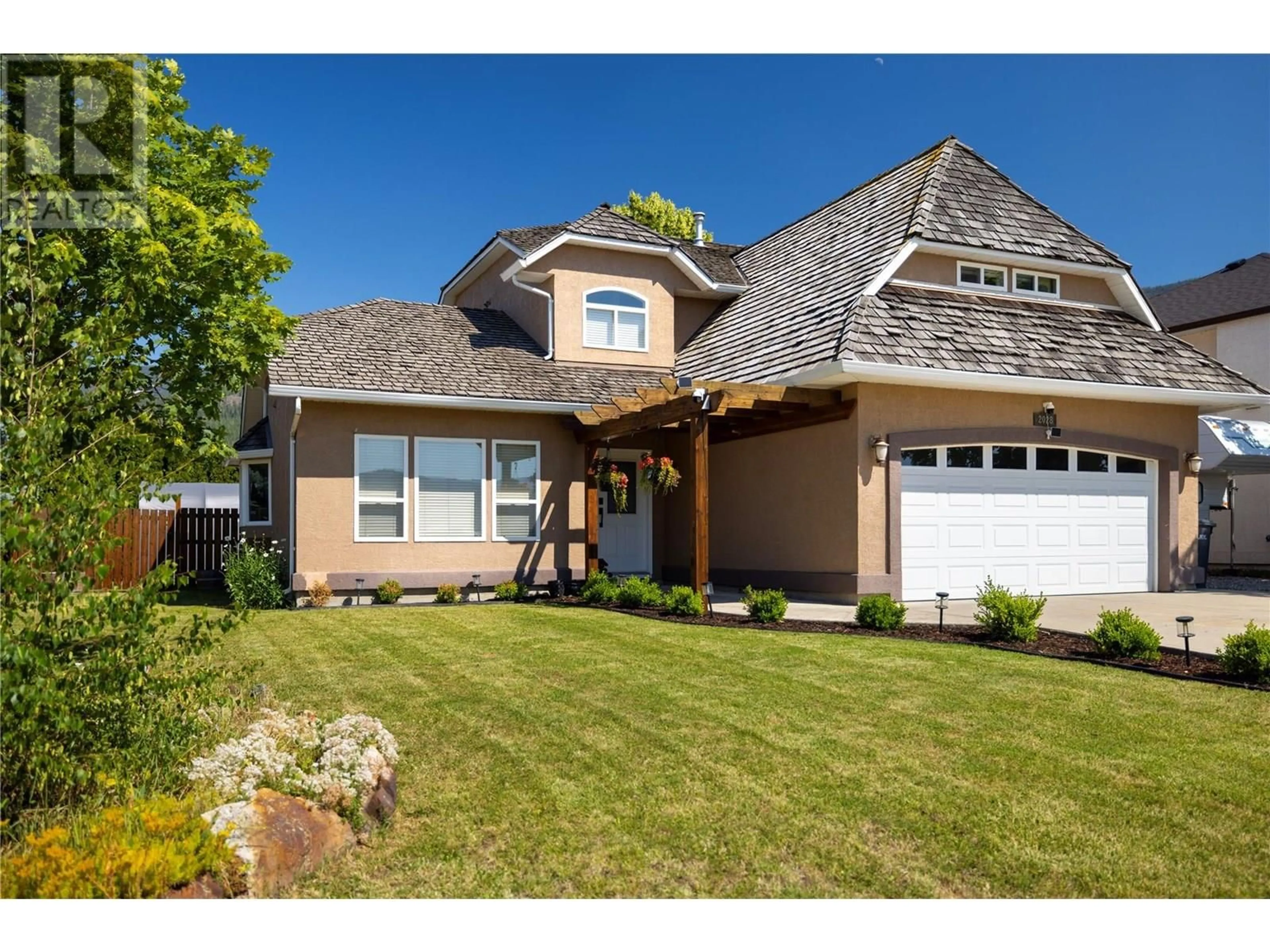 Home with vinyl exterior material, street for 2028 OKANAGAN STREET, Armstrong British Columbia V0E1B1