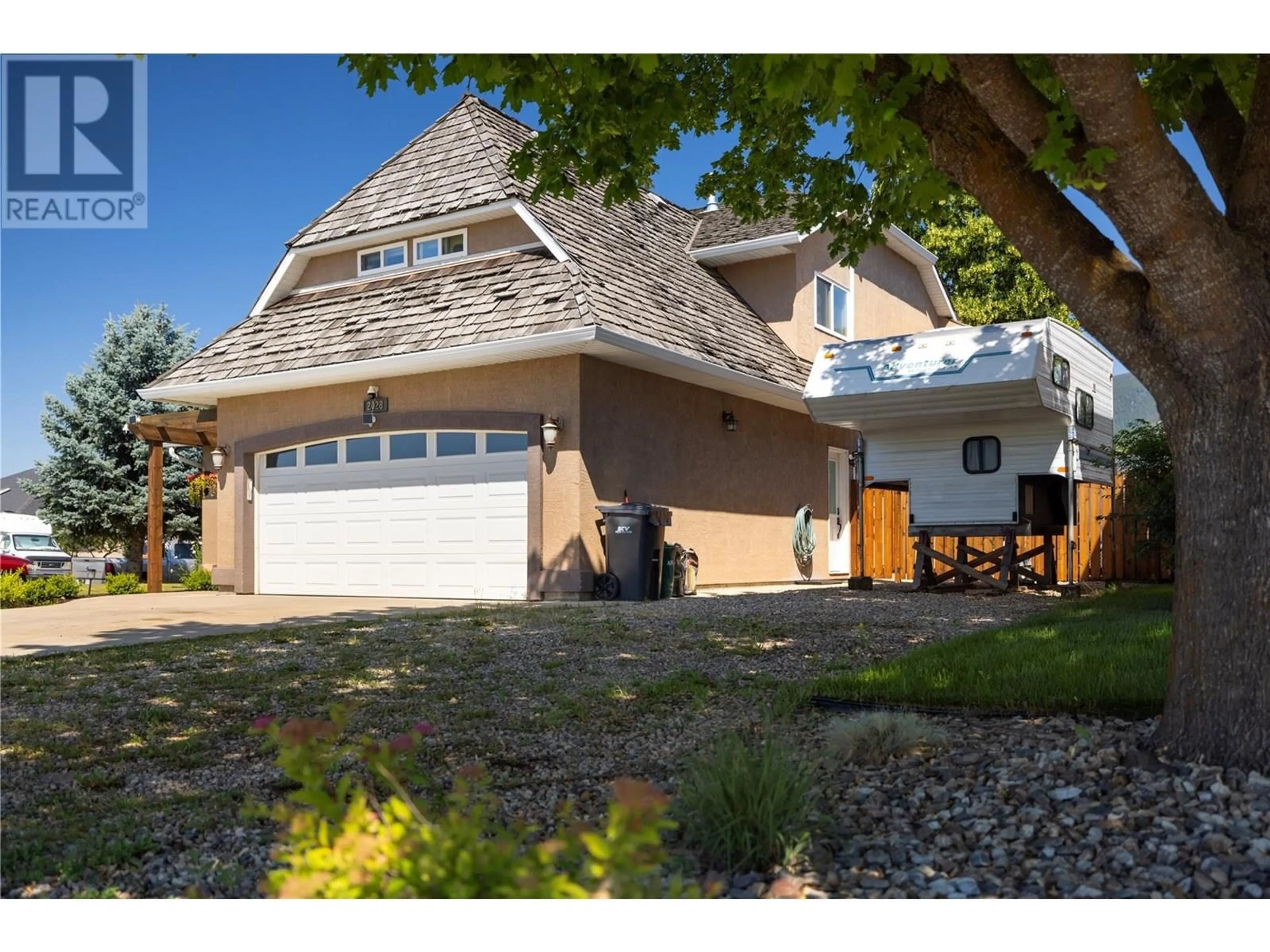Home with vinyl exterior material, street for 2028 OKANAGAN STREET, Armstrong British Columbia V0E1B1