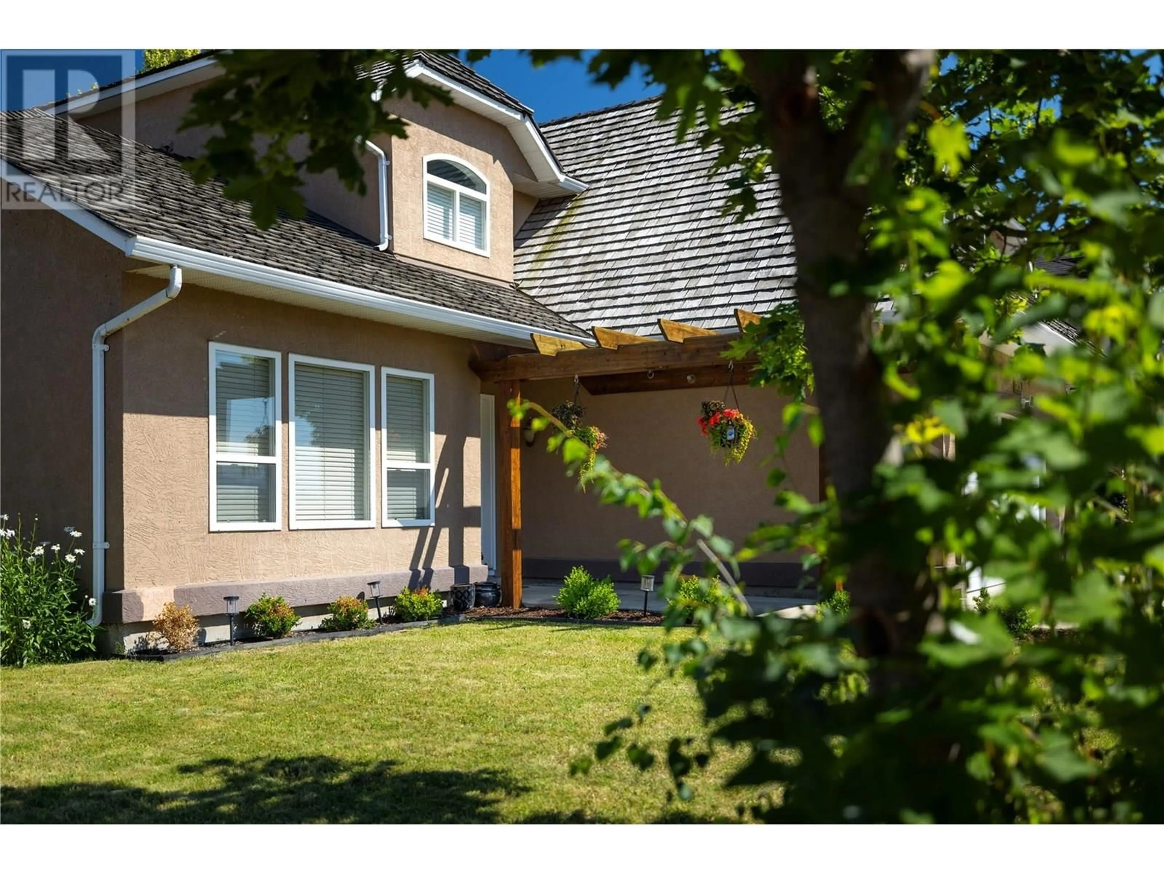 Home with vinyl exterior material, street for 2028 OKANAGAN STREET, Armstrong British Columbia V0E1B1