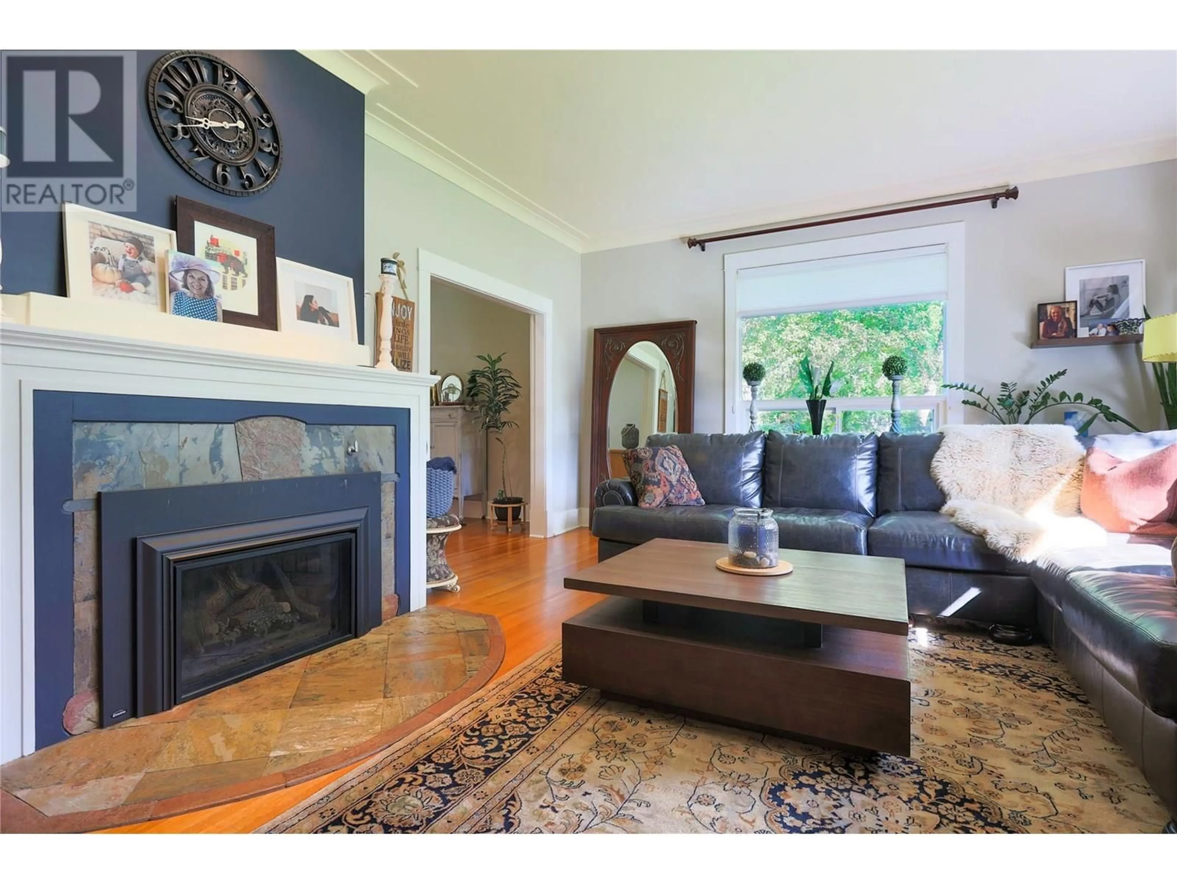 Living room with furniture, wood/laminate floor for 208 RITCHIE AVENUE, Trail British Columbia V1R1H2