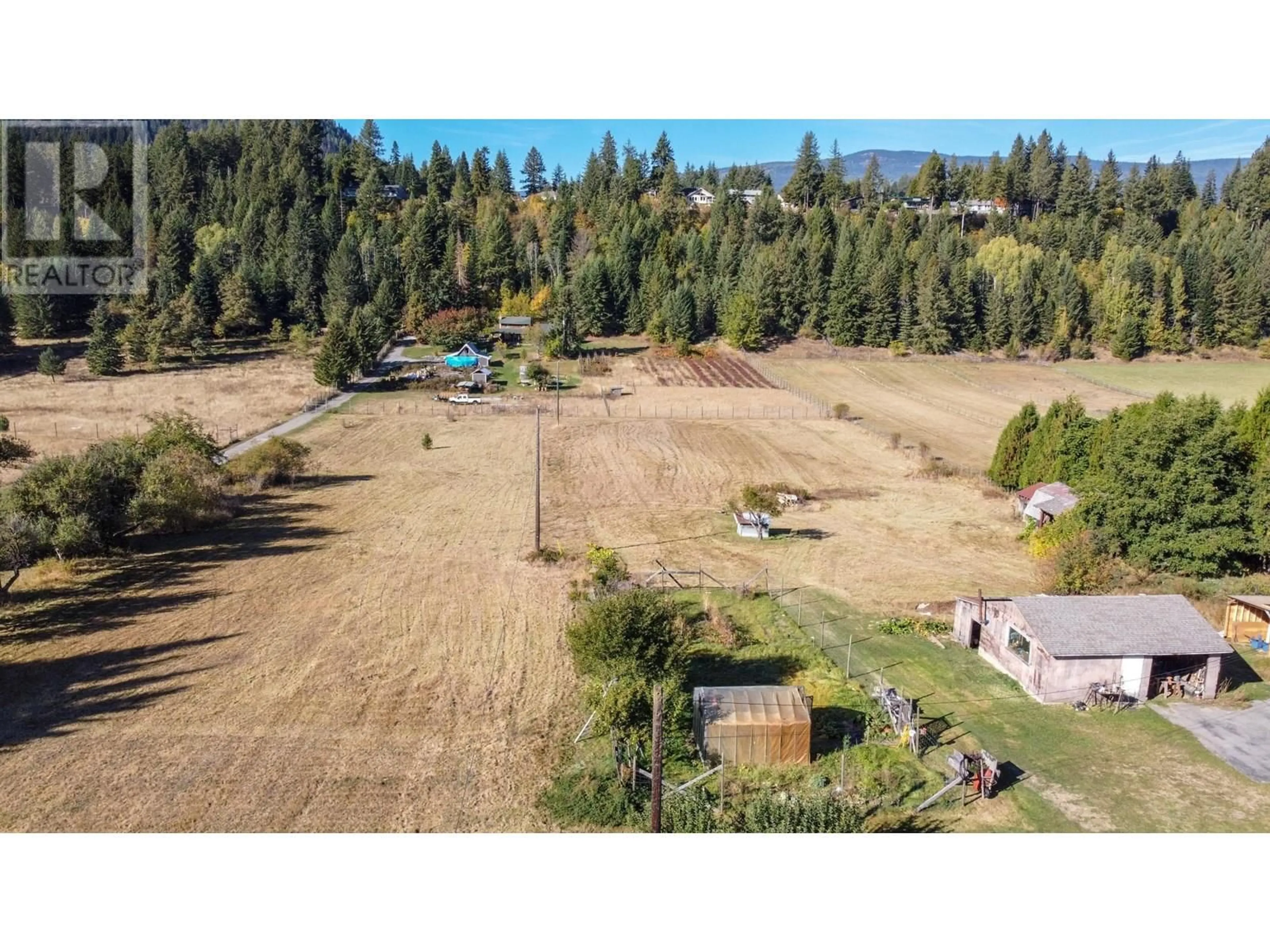 A pic from outside/outdoor area/front of a property/back of a property/a pic from drone, mountain view for 2697 SHOREACRES ROAD, Castlegar British Columbia V1N4R1